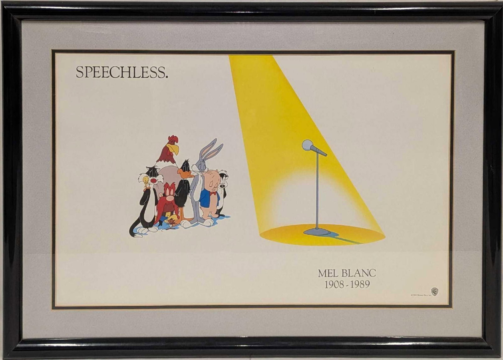 Framed Mel Blanc Speechless Tribute Warner Bros Print: Framed Mel Blanc Speechless Tribute Warner Bros Print. Mel Blanc past away in 1989. Warner Bros characters in silence, as the spotlight highlights the microphone. Classic image that every Looney 