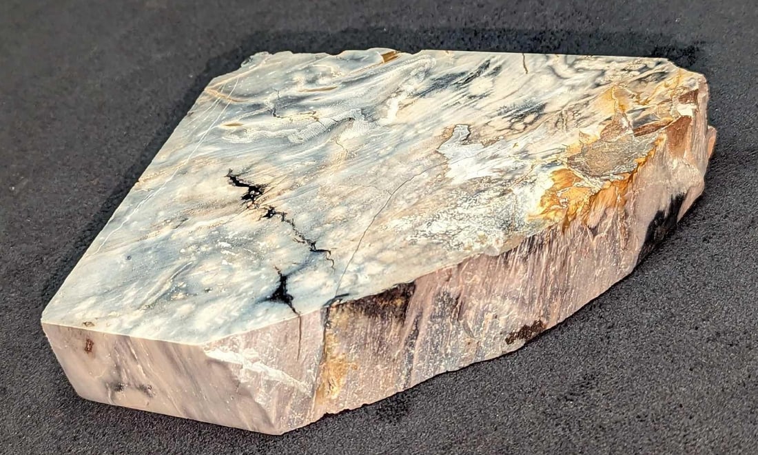 Natural Unpolished Rough Stone Slab: Natural Unpolished Rough Stone Slab. This is approx 4" x 4 7/8" x 1" and it weighs 1.39lb. The slab has some glue residue on the bottom.