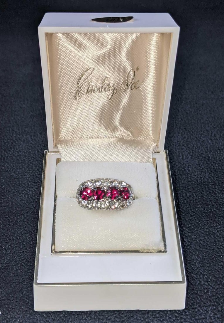 Vintage Silver Plated Ring Inside White Alsten Co: Vintage Silver Plated Ring Inside White Alsten Co This vintage ring is silver plated with glass gemstones. It sits in a white Alsten Co box with Eisenberg Ice is printed in gold lettering on the