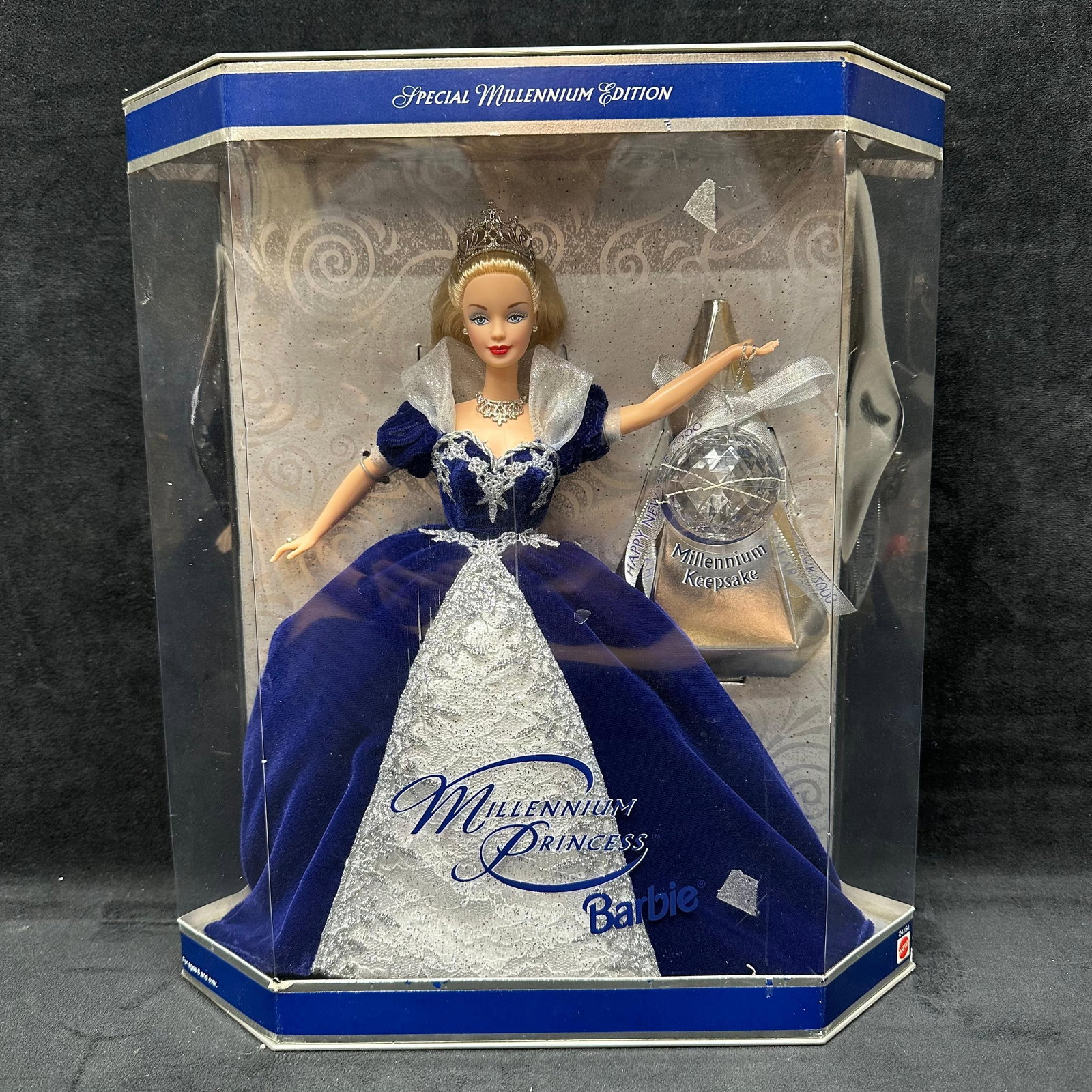 Millennium Princess Barbie Doll Special Millennium Edition B: Special Millennium Edition Millennium Princess Barbie doll, produced to commemorate the year 2000. Doll features a blue and silver formal gown with a tiara, necklace, and a Millennium Keepsake