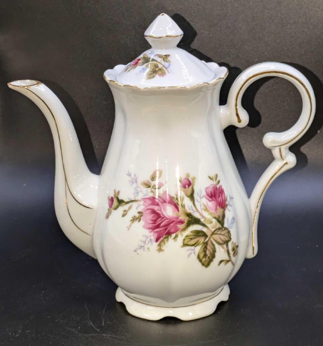 Vintage Gold Trim Royal Sealy Japan China Rose Teapot: Vintage Gold Trim Royal Sealy Japan China Rose Teapot. This is approx 7 1/2" x 4" x 7 1/2" and it weighs 0.90lbl. The teapot has no chips or cracks. It has some light markings.