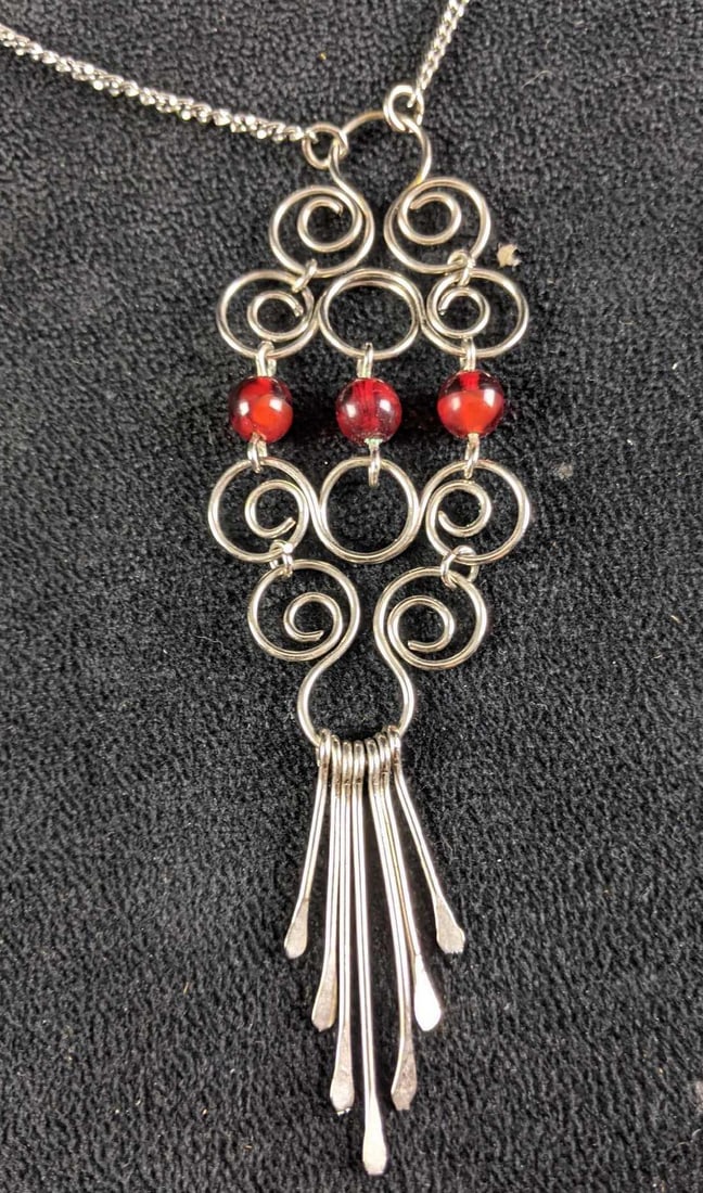 Necklace Wire Wrap Necklace Pendant and Necklace: Necklace Wire Wrap Necklace Pendant and Necklace This is a unique wire wrap-designed necklace that features red beads. The necklace is in good condition with a working clasp and no known tarnish.?