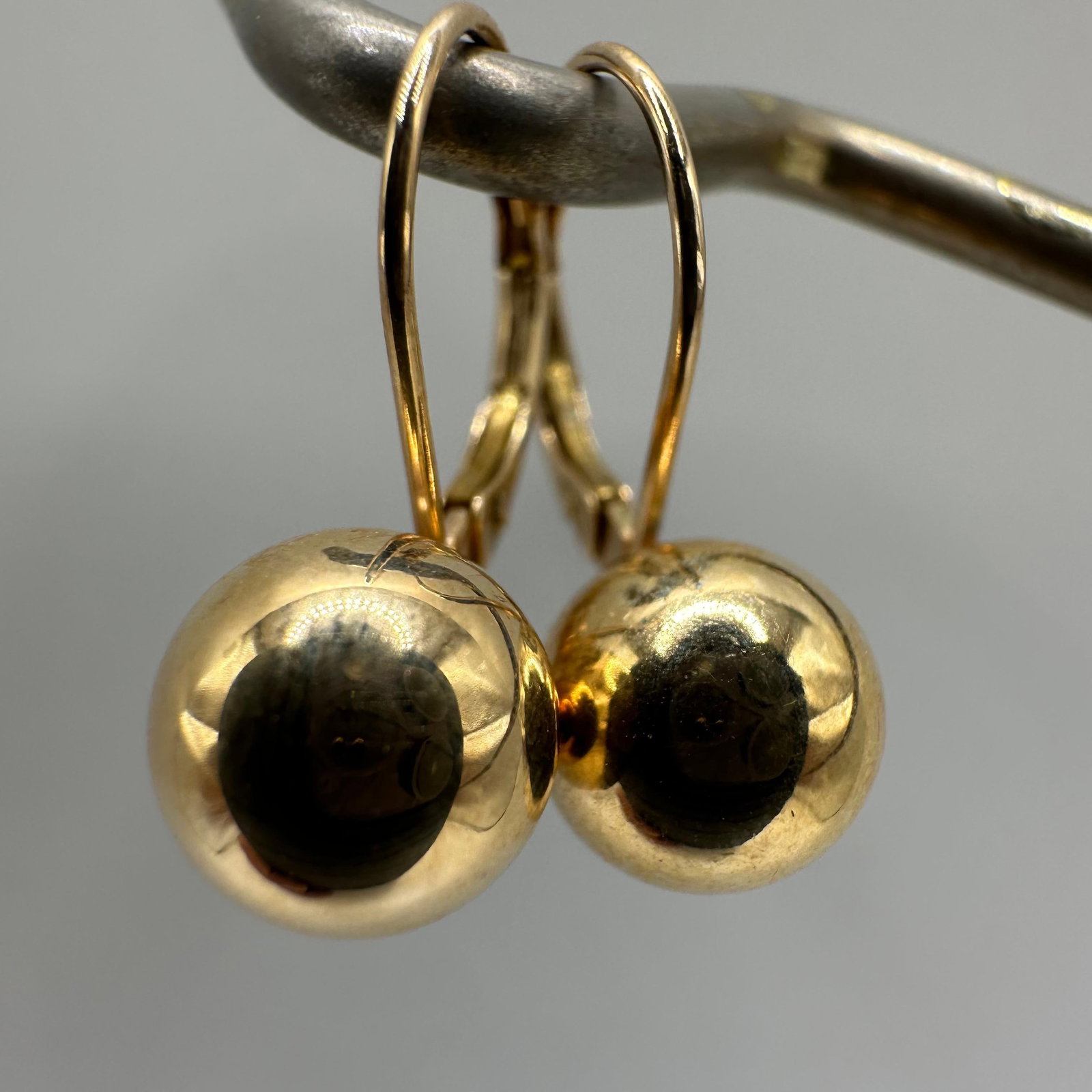 Gold Ball Stud Leverback Dangle Earrings 14K EG: This item is in good pre-owned, previously used/displayed condition with noticeable light wear and surface scratches. Please reference all photos for full details. This piece of jewelry has been teste