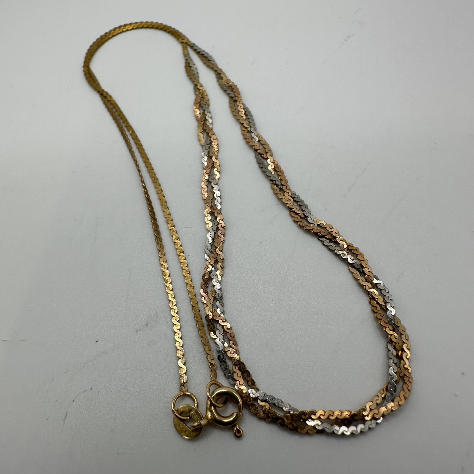 14K Tri Color Gold Woven Necklace Italy 16 Inch: This item is in good pre-owned, previously used/displayed condition with noticeable light wear and surface scratches. Please reference all photos for full details. This piece of jewelry has been teste
