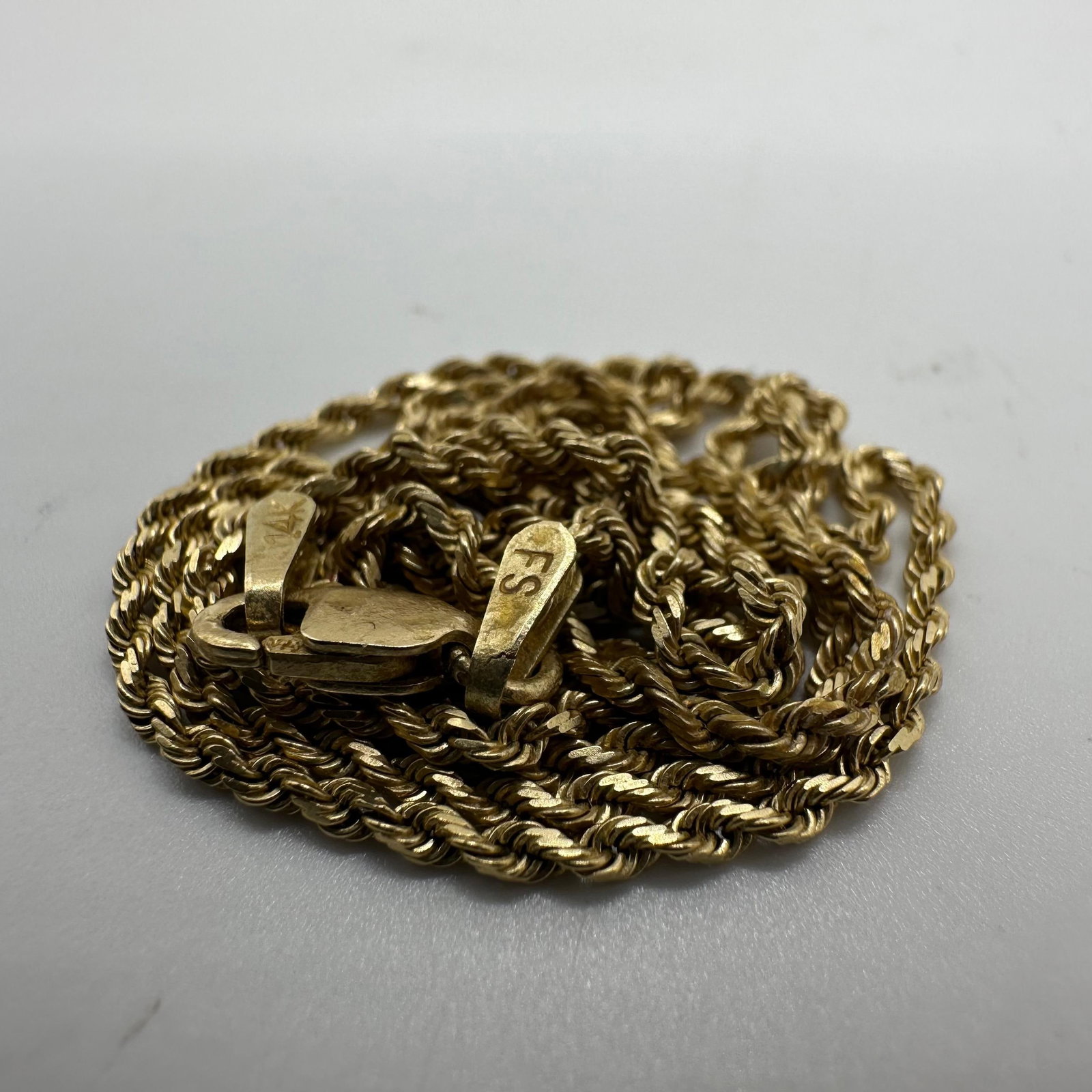 14K Gold FS Twist Rope Chain Necklace V92: This item is in good pre-owned, previously used/displayed condition with noticeable light wear and surface scratches. Please reference all photos for full details. This piece of jewelry has been