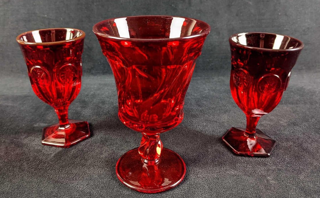 Vintage Fostoria Ruby Wine And Ice Tea Glasses: This lot includes: (2)?Vintage Fostoria Ruby Coin Wine Glasses. These are approx 2 3/4" x 2 3/4" x 5" and are in a good, vintage condition with no known damage. (1)?Vintage Fostoria
