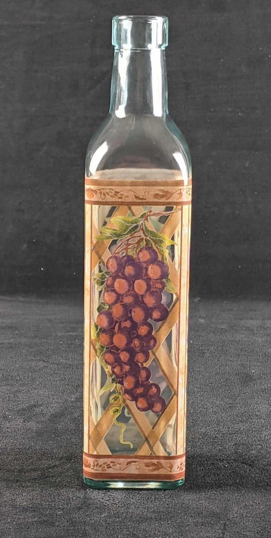 Decorative Bottle: Decorative Bottle This is a decorative glass bottle with grapes and a basket design on it. Great kitchen decoration. There is no known damage.? 10in tall Weight: 0.8lbs