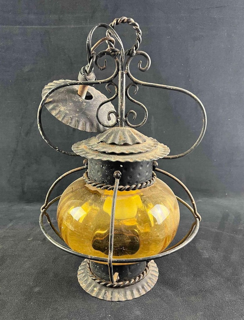 Vintage Amber Globe Lamp: Vintage Amber Globe Lamp This vintage lamp ias made from beautiful amber glass encased?in metal. This is made bas a ceiling lamp and has a small part on top to hang and connect wiring. The lamp has