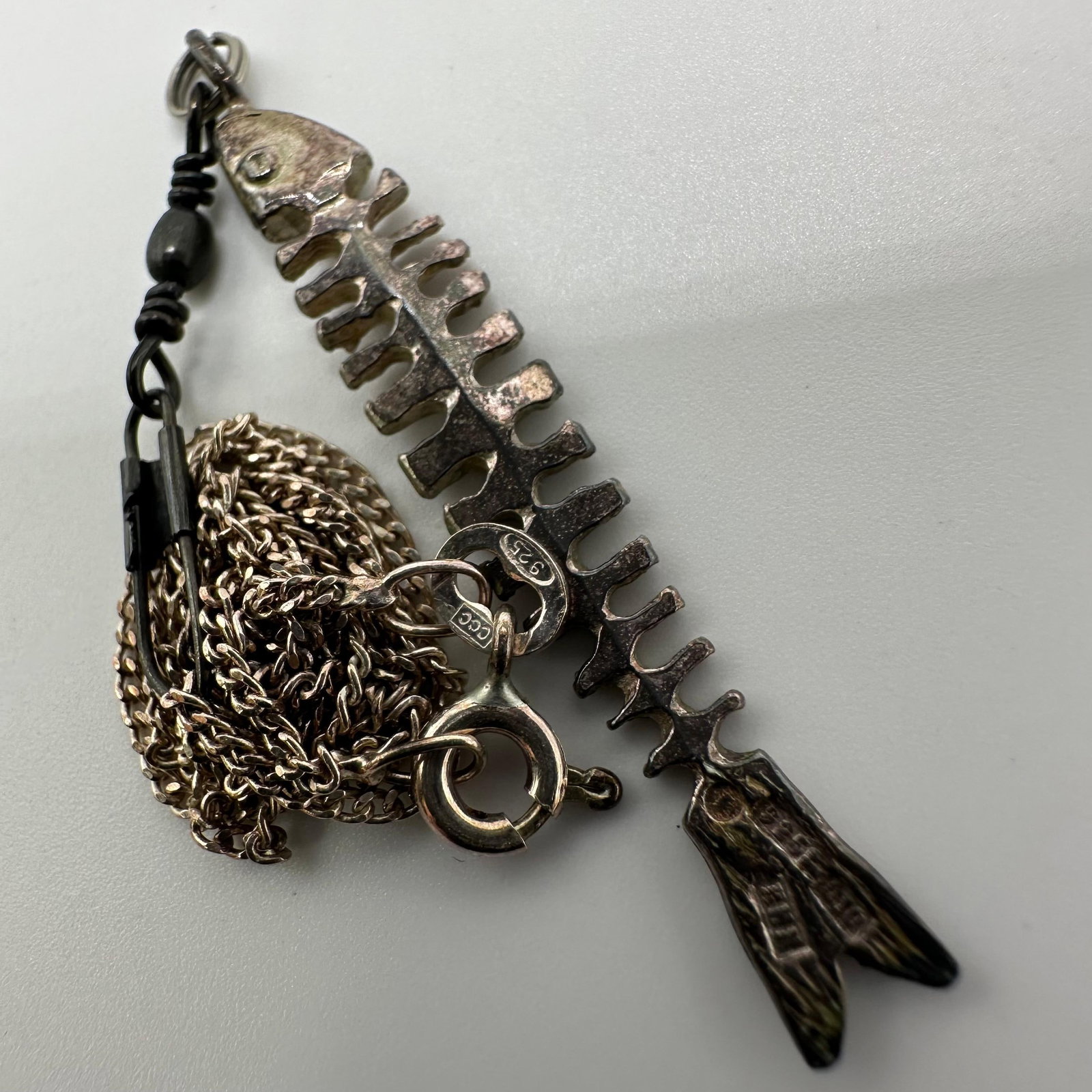 Sterling Silver Fish Skeleton 925 Necklace and Pendant: This item is in good pre-owned, previously used/displayed condition with noticeable light wear and surface scratches. Please reference all photos for full details. This piece of jewelry has been teste