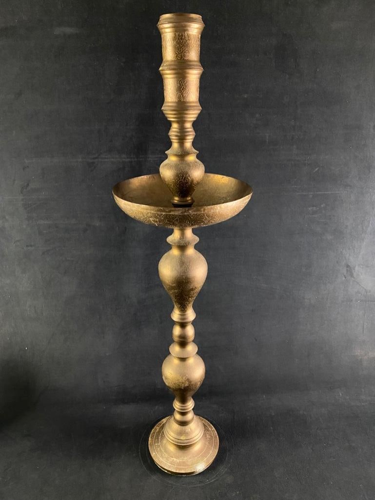 Vintage Moroccan Brass Floor Candleholder: Vintage Moroccan Brass Floor Candleholder Brass candleholder from Morocco, with arabesque designs etched into the brass. Sits on the floor, and has built in drip pan to catch any wax. Likely from the