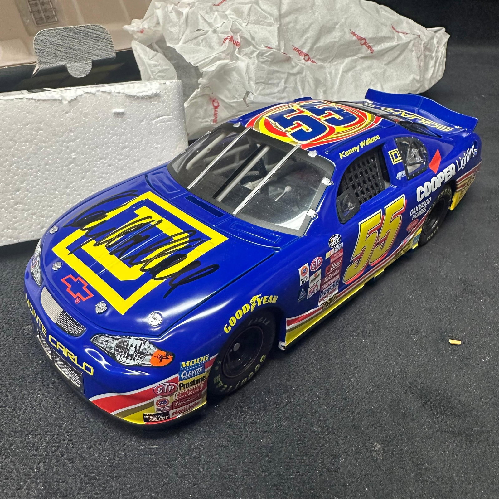 Team Caliber Preferred 1:24 NASCAR Die-Cast Car Kenny Wallace #55 Square D Monte Carlo Signed: Limited edition 1:24 scale NASCAR die-cast car by Team Caliber Preferred. This example represents the #55 Square D Chevrolet Monte Carlo driven by Kenny Wallace. The car is hand-signed on the hood by 