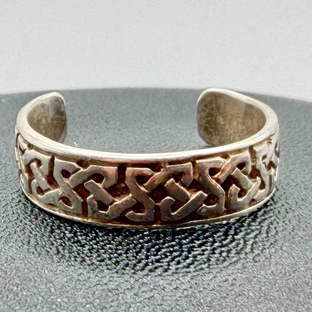 Adjustable Sterling Ring With Celtic Knot Design: This piece of jewelry has been tested and researched prior to listing. Please view all our pictures they are part of our description. DETAILS: Metal - Sterling Silver Color - Silver Stones - none