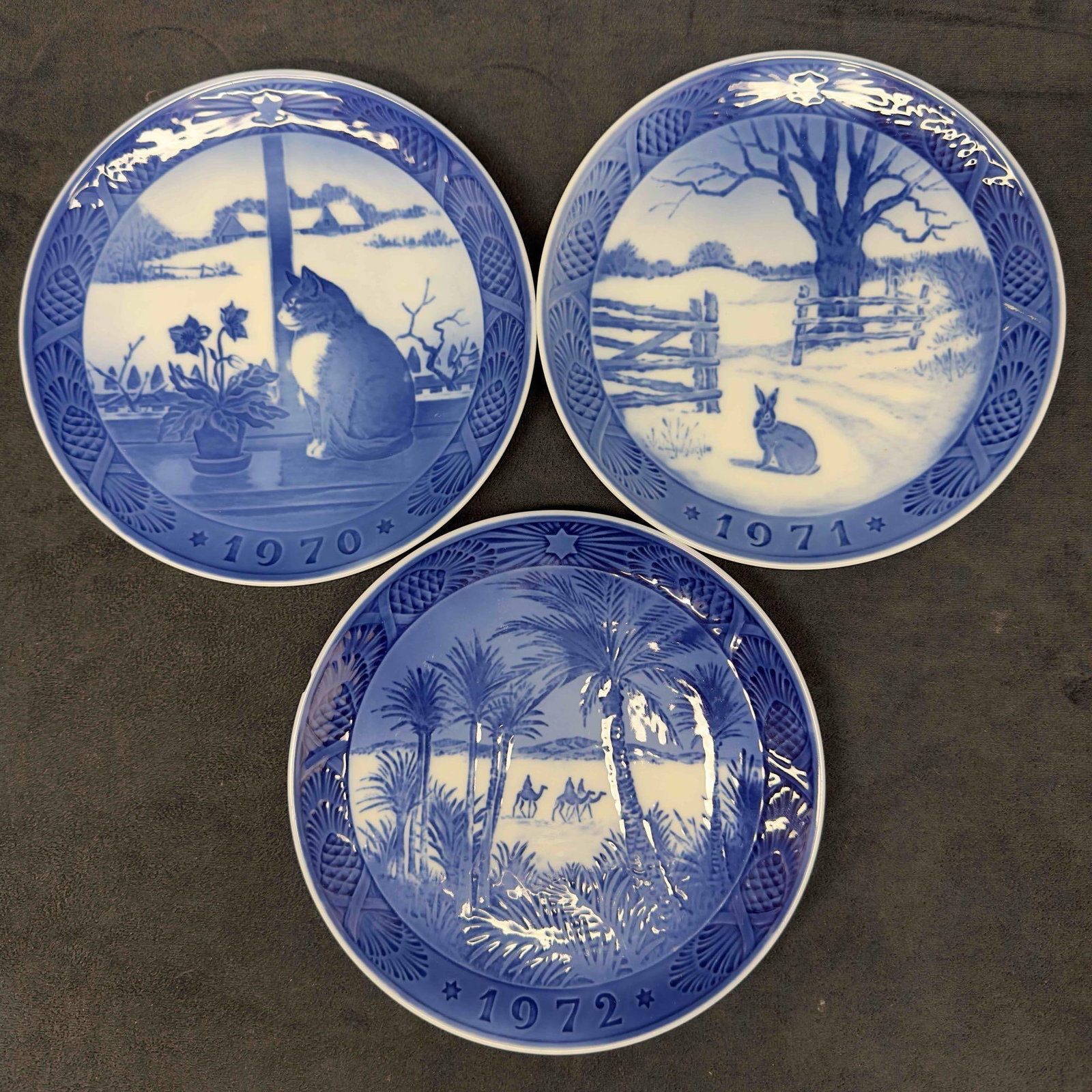 Royal Copenhagen Denmark 1970's Plate Set Kai Lange Lot of Three Christmas Plates: Royal Copenhagen Denmark 1970's Plate Set Kai Lange Lot of Three Christmas Plates. Three plates included in this set featuring 1970 Christmas Rose and Cat, 1971 Hare in Winter, and Osterland in th