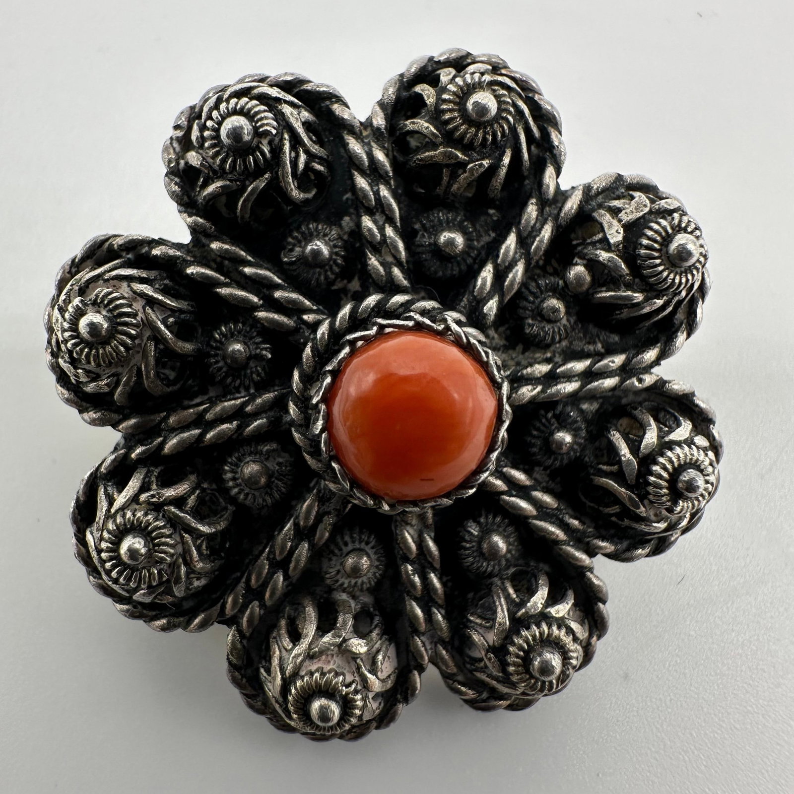 Red Coral Central Cabochon Silver Filigree Flower Brooch Q68: This item is in good pre-owned, previously used/displayed condition with noticeable light wear and surface scratches. Please reference all photos for full details. This piece of jewelry has been teste
