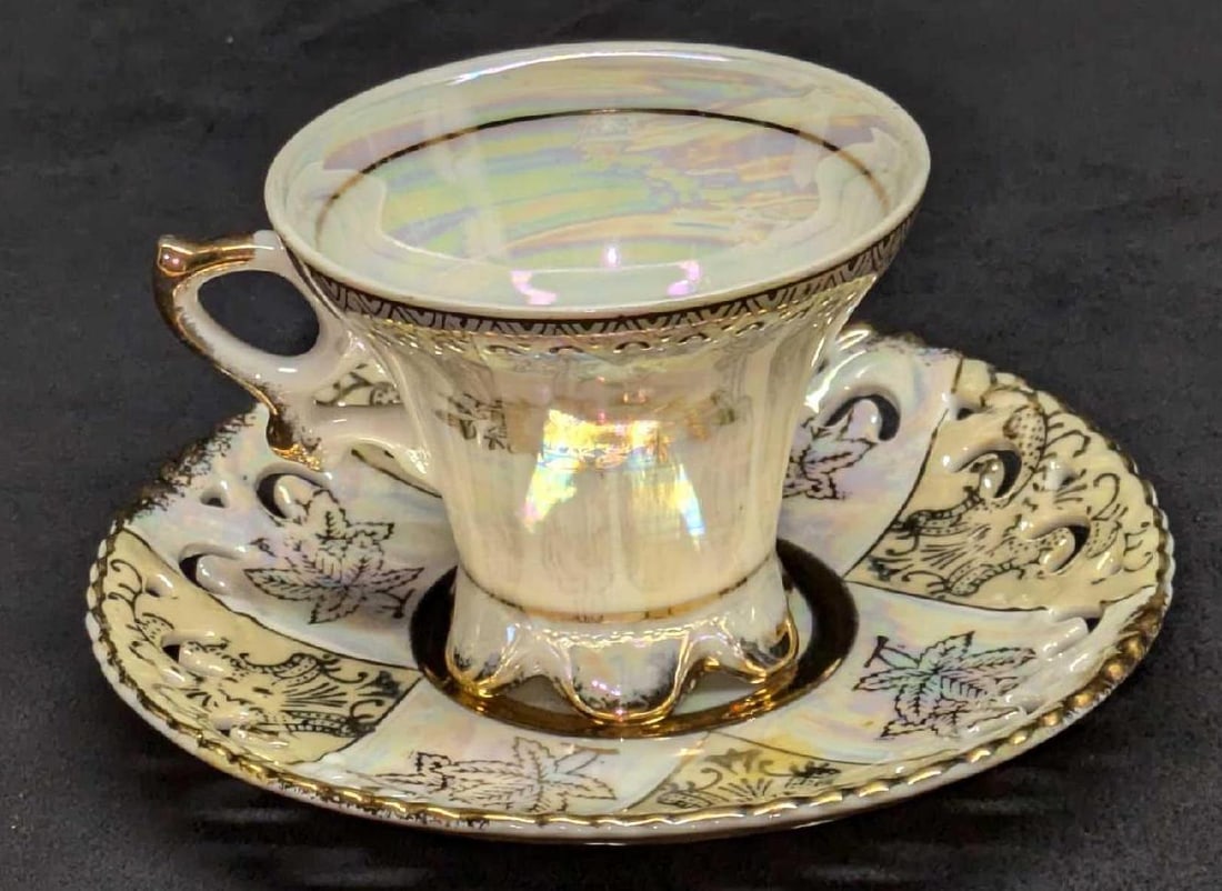 Vintage Lusterware Royal Crown Teacup And Saucer With Gold Trim: Vintage Lusterware Royal Crown Teacup And Saucer With Gold Trim. The saucer is approx 6" x 6' x 3/4". The cup is approx 4 1/4" x 3 5/8" x 3". The total weight is 0.61lb. The saucer and teacup have som