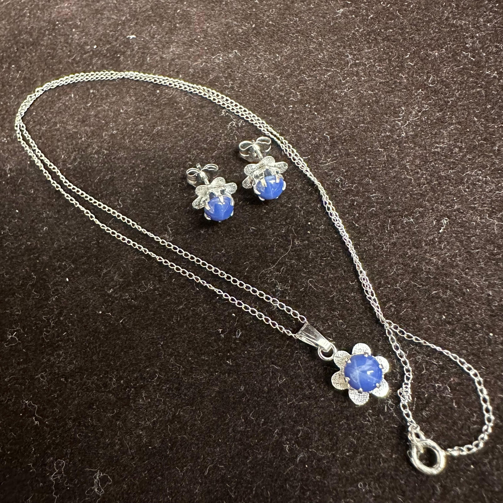 Star Sapphire Blue Cabochon Floral Motif 14K Gold Earrings and Necklace Set: This item is in good pre-owned, previously used/displayed condition with noticeable light wear and surface scratches. Please reference all photos for full details. This piece of jewelry has been teste