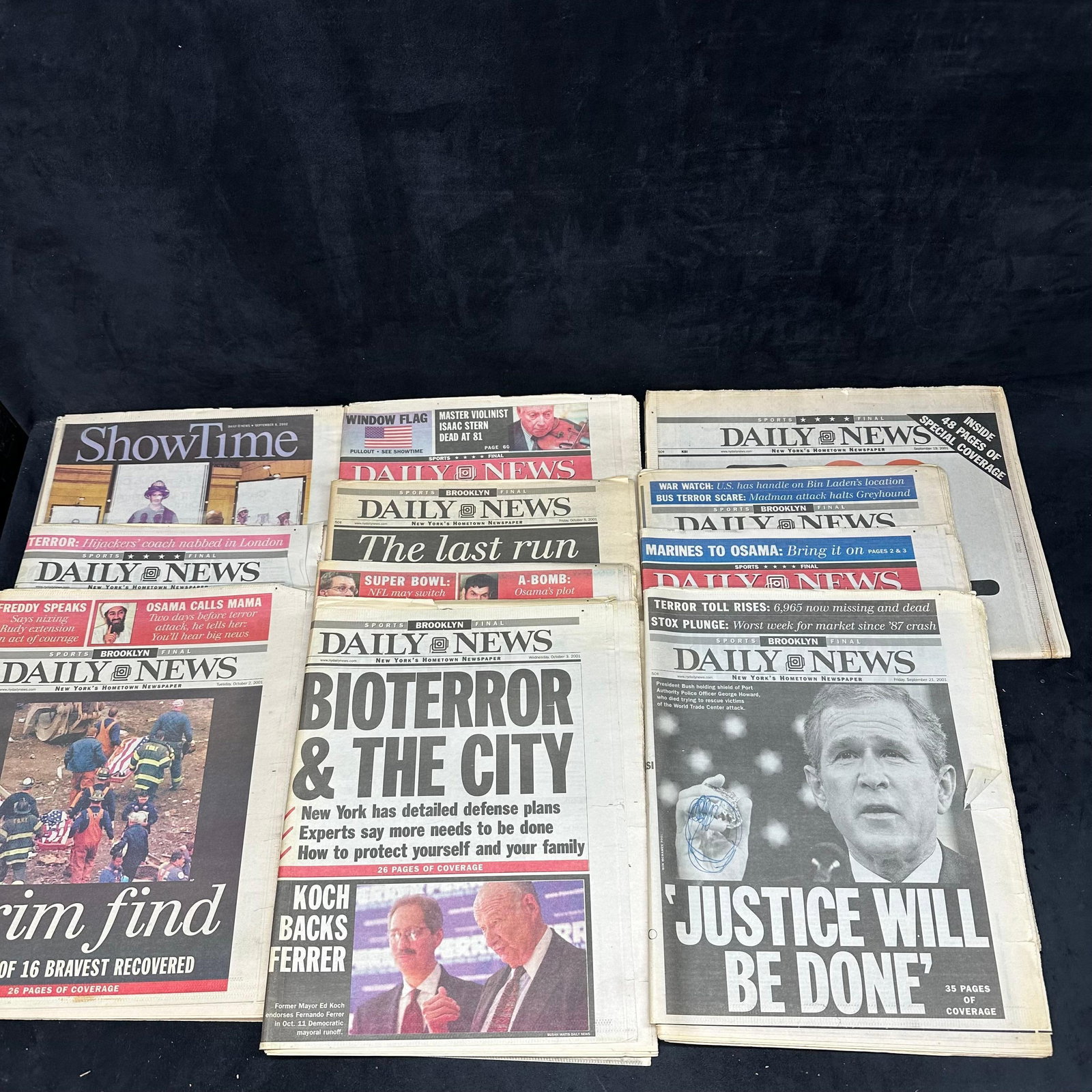 Collection of New York Daily News September 911 Era Front Pages Newspaper Set: Group of original New York Daily News newspapers from September and October 2001, featuring prominent post-9/11 front-page coverage. Headlines include themes such as the World Trade Center attacks, re