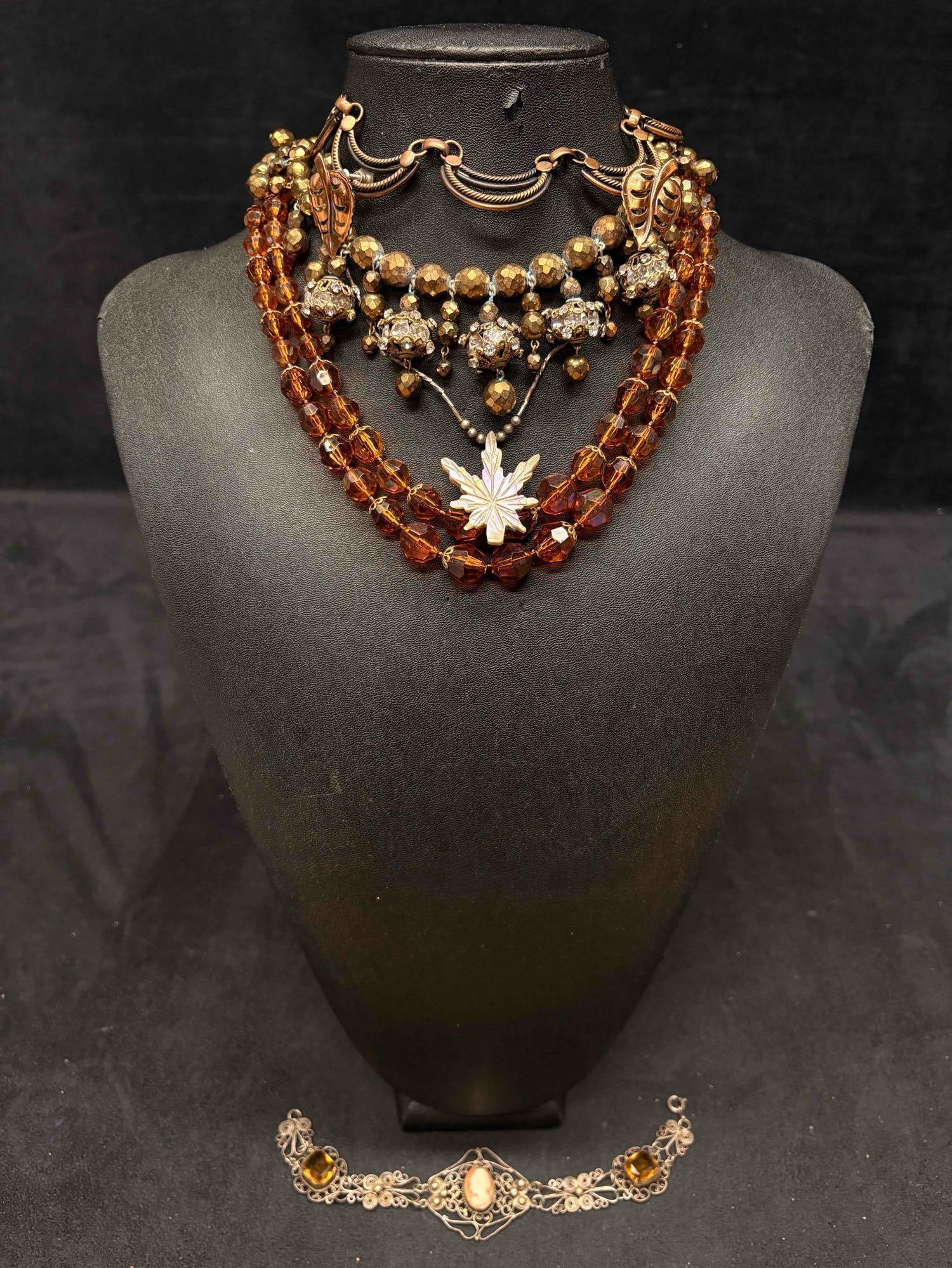 5pc Brown and Gold Pumpkin Spice Necklace Lot: This lot consists of 5 pre-owned costume jewelry necklaces with typical wear from use. Please review images for context of the lots visual conditions.A PPROX. WEIGHT: 6.7 OZ