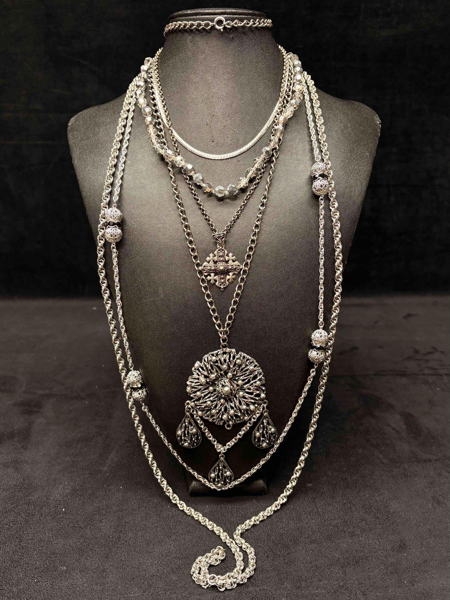 6pc Silver Eccentric Statement Necklace Lot: This lot consists of 6 pre-owned costume jewelry necklaces with typical wear from use. Please review images for context of the lots visual conditions. APPROX. WEIGHT: 8 OZ