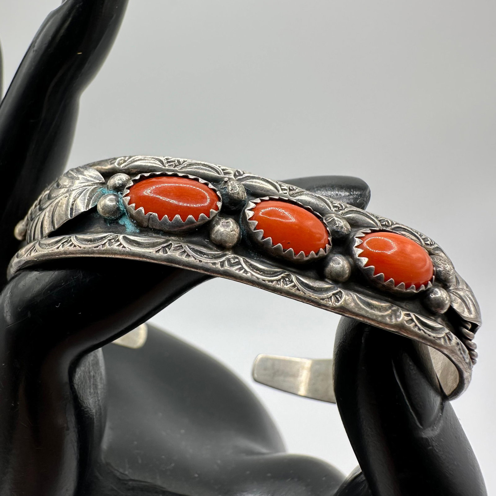 LJ Navajo Native Hallmark Three Red Coral Silver Bracelet Feather Leaf Motif: This item is in good pre-owned, previously used/displayed condition with noticeable light wear and surface scratches. Please reference all photos for full details. This piece of jewelry has been teste