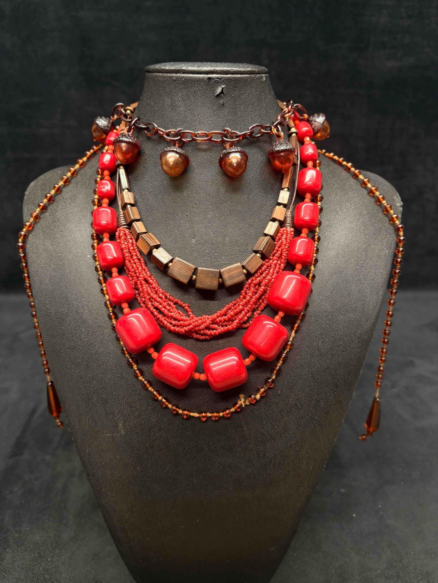 5pc Brown and Red Cinnamon Spiced Necklace Lot: This lot consists of 5 pre-owned costume jewelry necklaces with typical wear from use. Please review images for context of the lots visual conditions. APPROX. WEIGHT: 5.6 OZ
