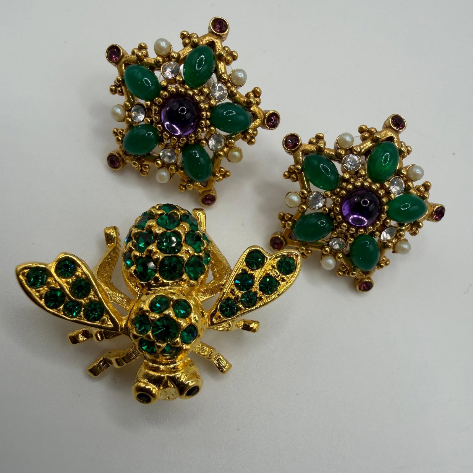 Joan Rivers Emerald Green Bee and Rhinestone Earrings Group HH30: Joan Rivers jewelry lot features a green crystal bee brooch and a pair of ornate jewel-tone earrings accented with green cabochons, purple stones, faux pearls, and clear crystals. These costume jewelr