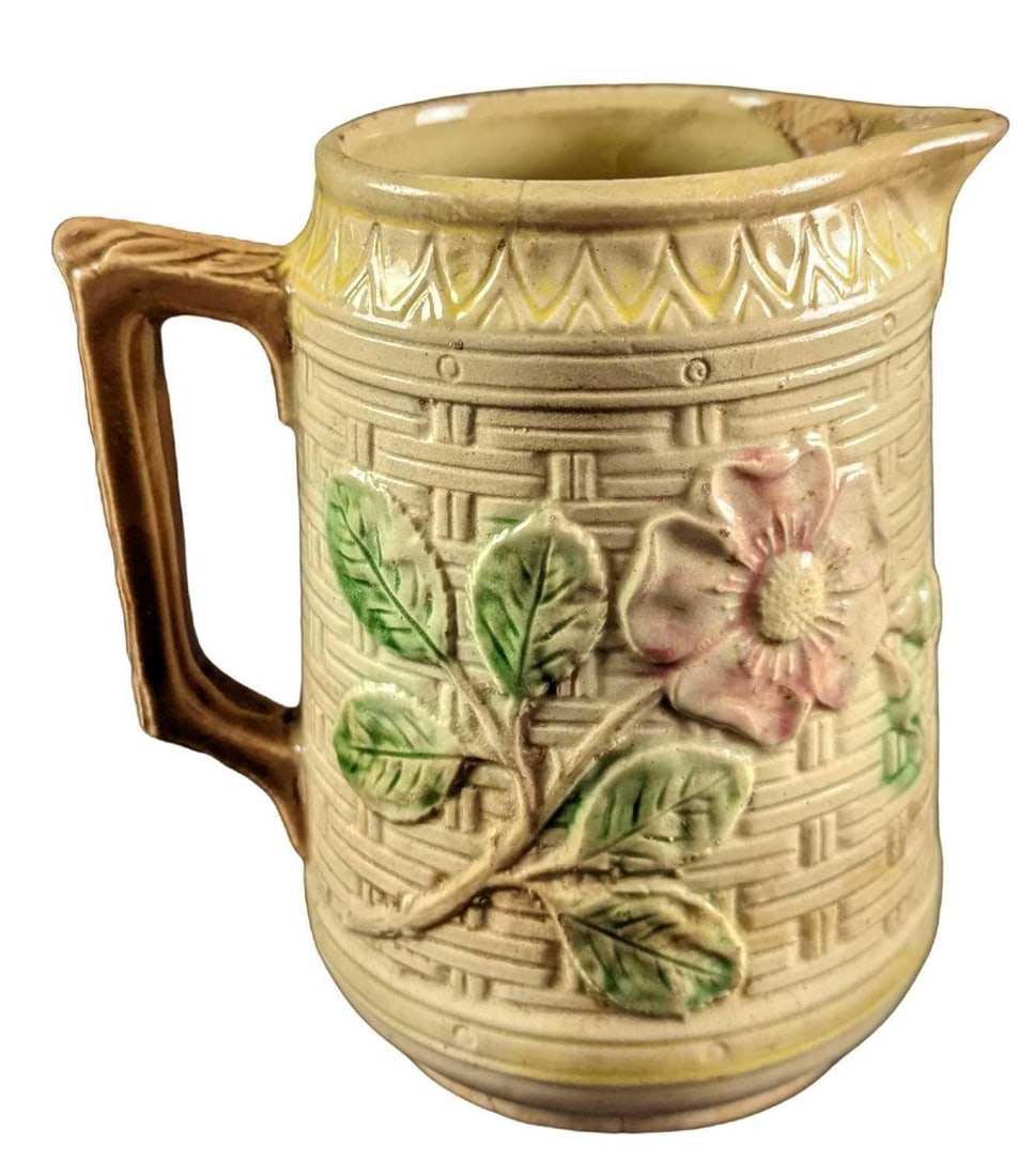 Vintage Ceramic Floral Pitcher: Vintage Ceramic Floral Pitcher. Its maker and date of creation are unknown. The pitcher is approx 6" x 5" x 6 1/2" and it weighs 1.56lb. The pitcher is in a fair, vintage condition with crazing and cr