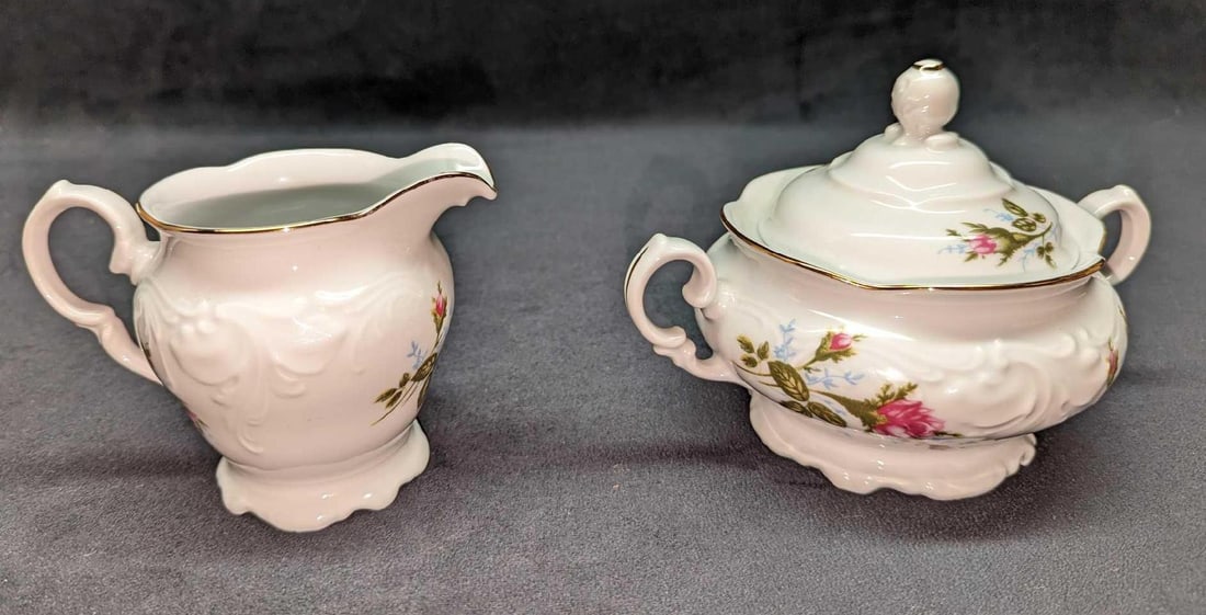 Retired Royal Kent China Sugar Bowl & Creamer: Retired Royal Kent China Sugar Bowl & Creamer. This lot includes: (1) Creamer. This is approx 5 1/4" x 4" x 4". (1) Sugar Bowl With Lid. This is approx 7" x 5" x 4