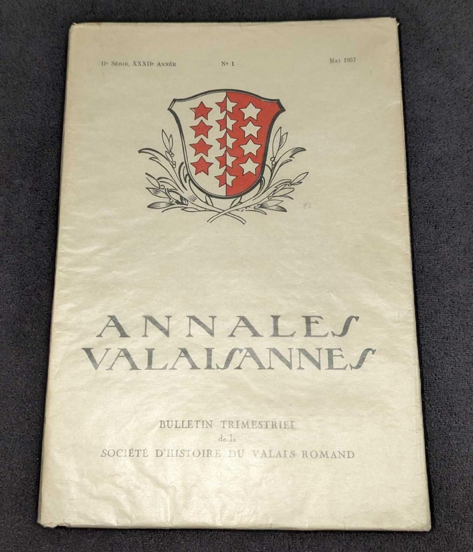 May 1957 Annales Valaisannes Softcover: May 1957 Annales Valaisannes Softcover. This softcover is approx 6 1/2" x 1/4" x 9 3/8" and it weighs 0.50lb. The pages have wrinkles/damp staining. The text included in this book is all French.