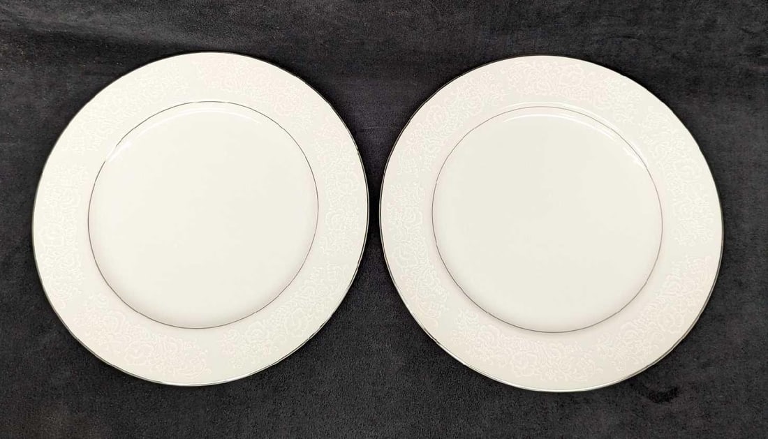 2 Retired International Fine China Juliet Dinner Plates A: 2 Retired International Fine China Juliet Dinner Plates A. Each plate is approx 7 5/8" x 7 5/8" x 3/4" and the total weight is 2.37 lbs. The plates do not have any chips or cracks. There are some