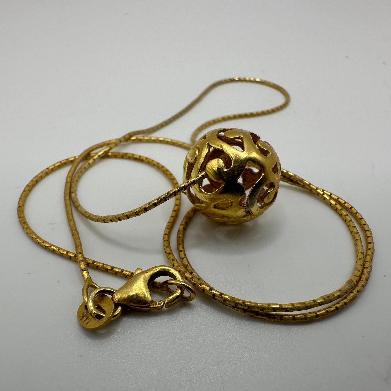 Hallow Ball Pendant 14K Gold Italy LLK Necklace: This item is in good pre-owned, previously used/displayed condition with noticeable light wear and surface scratches. Please reference all photos for full details. This piece of jewelry has been teste