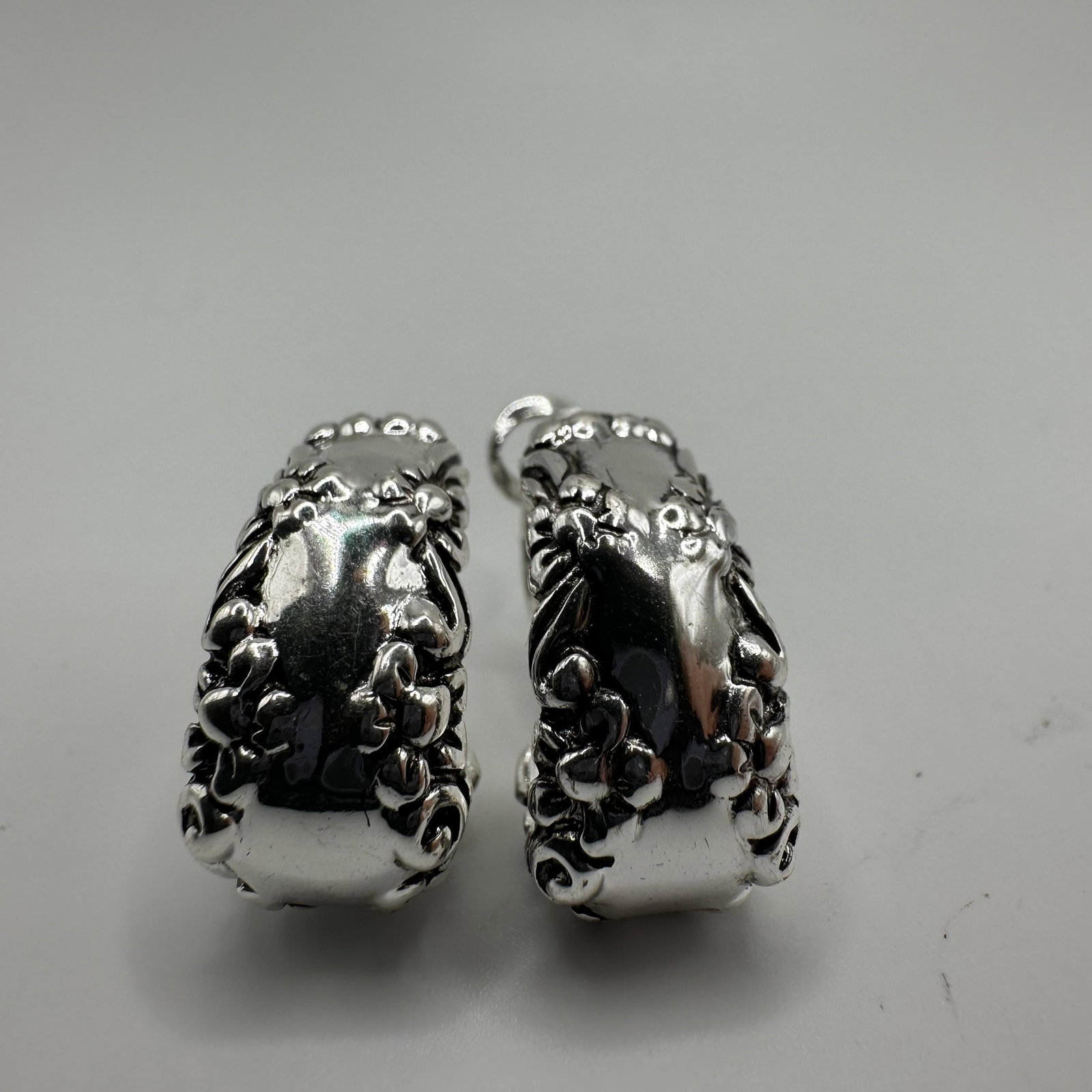 Ornate Hoop 925 Silver Earrings: This item is in good pre-owned, previously used/displayed condition with noticeable light wear and surface scratches. Please reference all photos for full details. This piece of jewelry has been teste