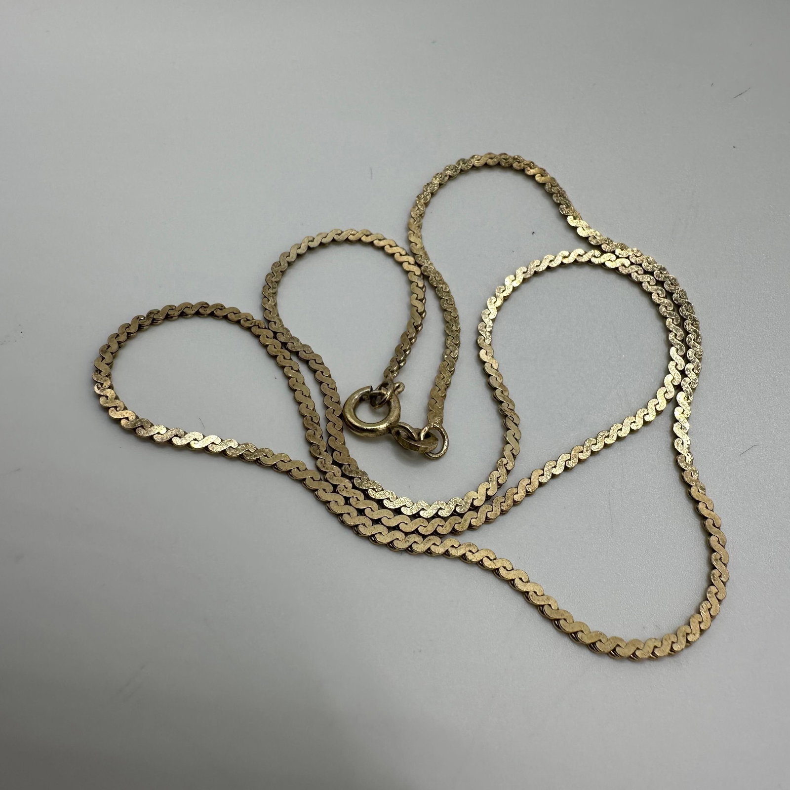 Gold Vermeil Italy 925 Sterling Silver Flat S Link Necklace: This item is in good pre-owned, previously used/displayed condition with noticeable light wear and surface scratches. Please reference all photos for full details. This piece of jewelry has been teste