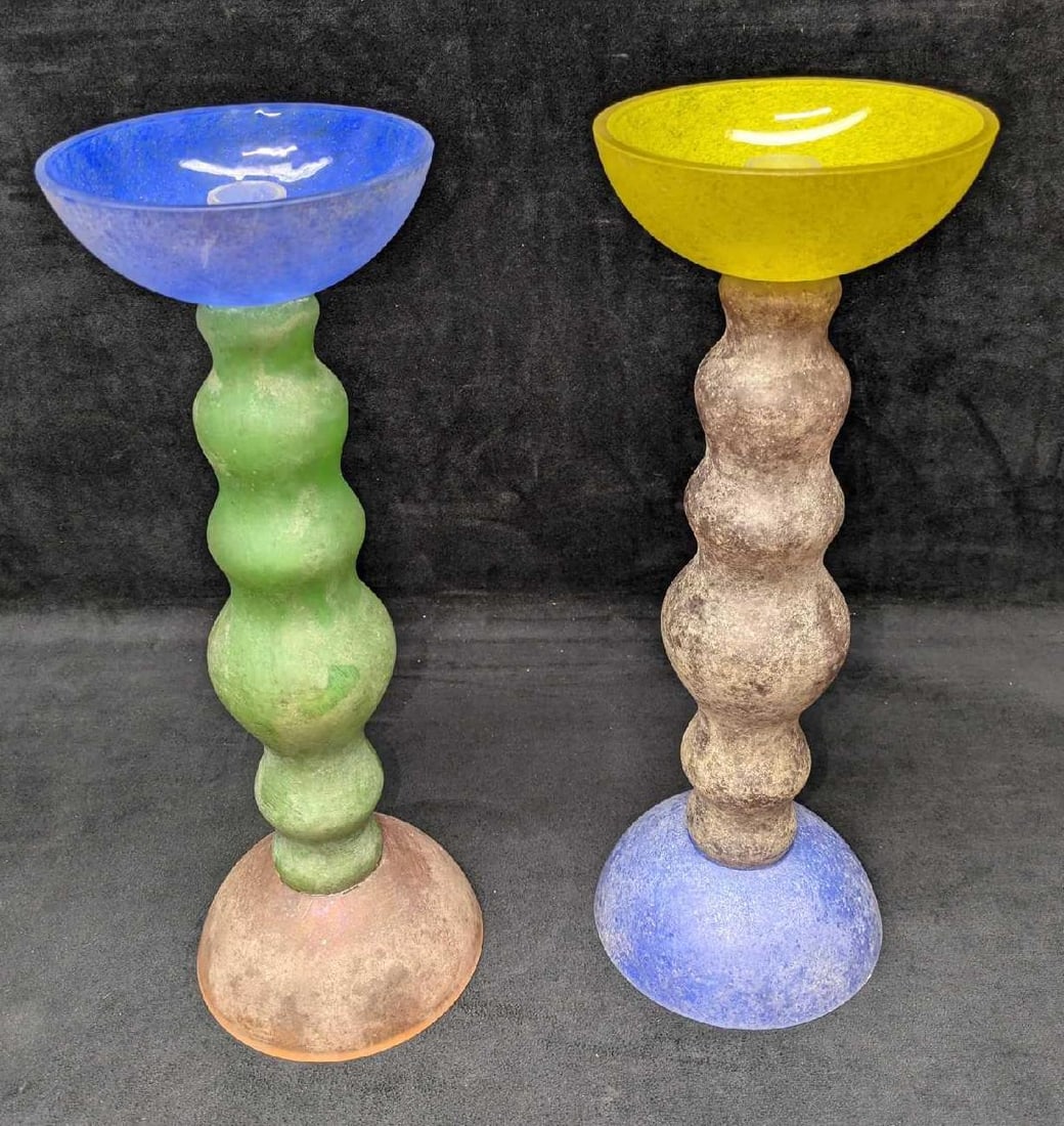 Two Colorful Frosted 14" Glass Candlestick Holders: Two Colorful Frosted 14" Glass Candlestick Holders. The maker and date of creation is unknown. Each is approx 5 1/4" x 5 1/4" x 14 7/8" and the total weight is 5.80lbs. One of the bottom bases has som