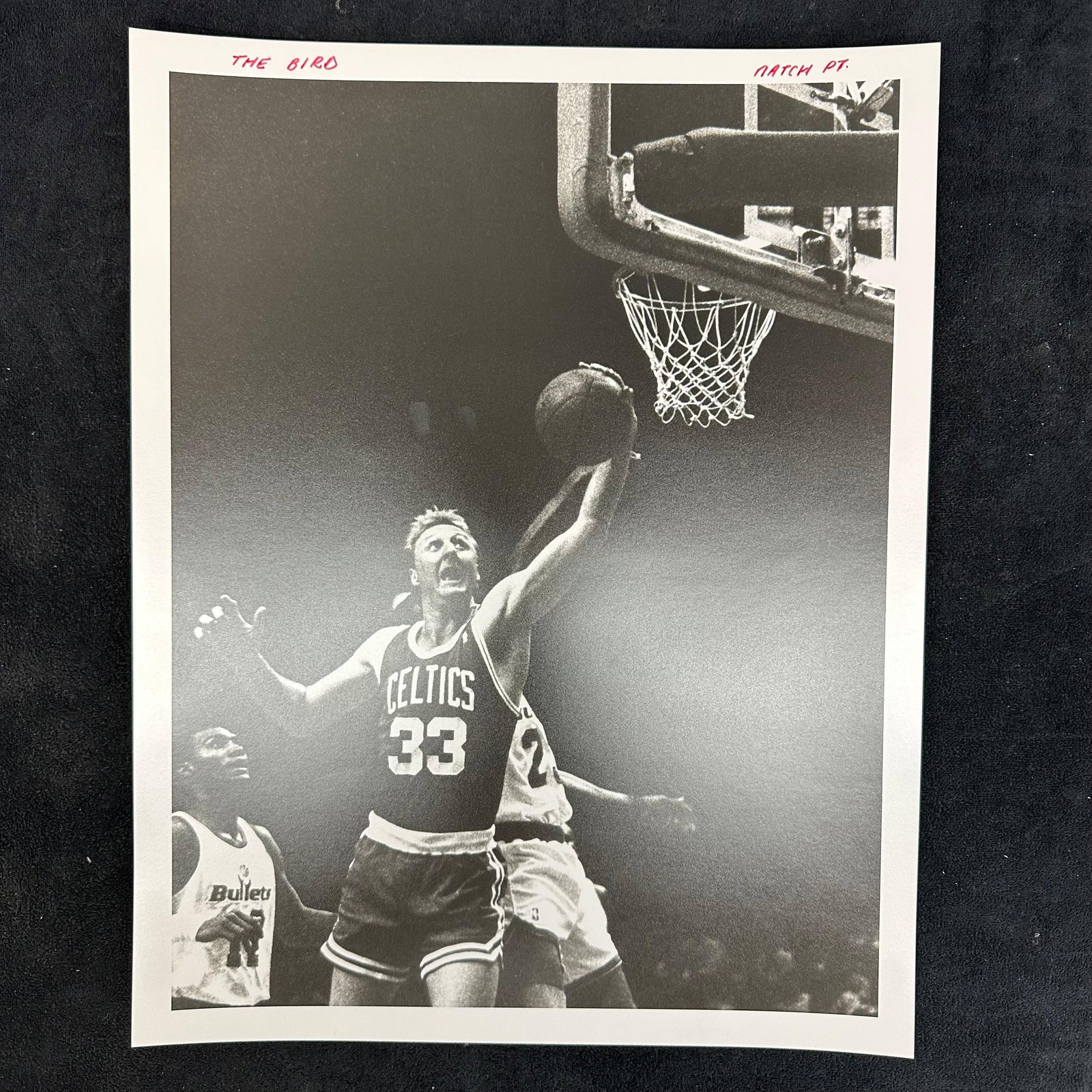 Larry Bird The Bird Boston Celtics Silver Gelatin Print Basketball: Black-and-white analog photo print of Hall of Famer Larry Bird (#33) of the Boston Celtics driving to the basket against the Washington Bullets. A classic action shot capturing Bird in mid-air, showca