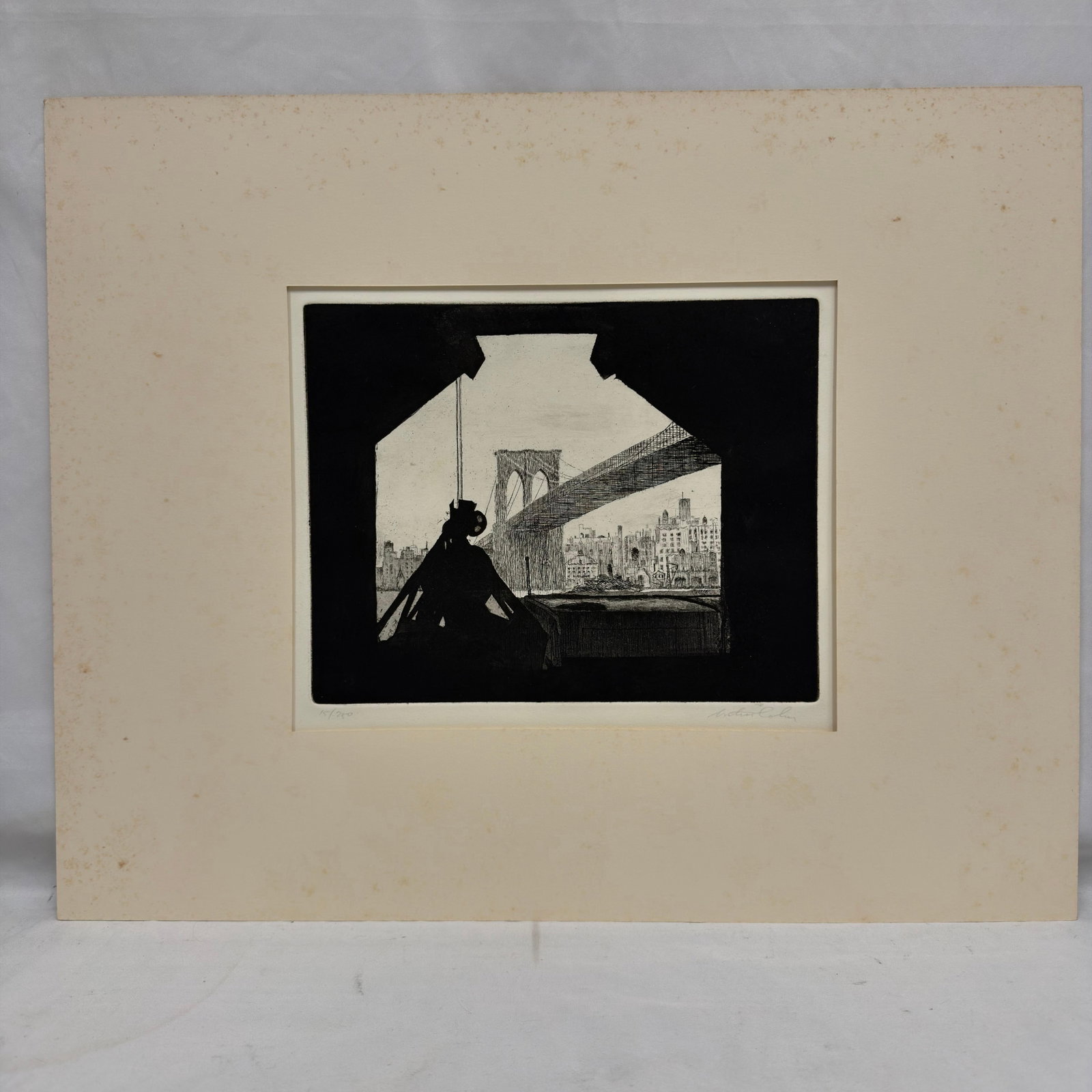 Arthur Cohen Bridge Silhouette Pencil Signed Etching Edition 15/250: Signed etching and aquatint titled Bridge Silhouette 1982 by Arthur Cohen. Pencil signed lower right and numbered 15/250 lower left. Depicts a silhouetted figure with the Brooklyn Bridge and New York 