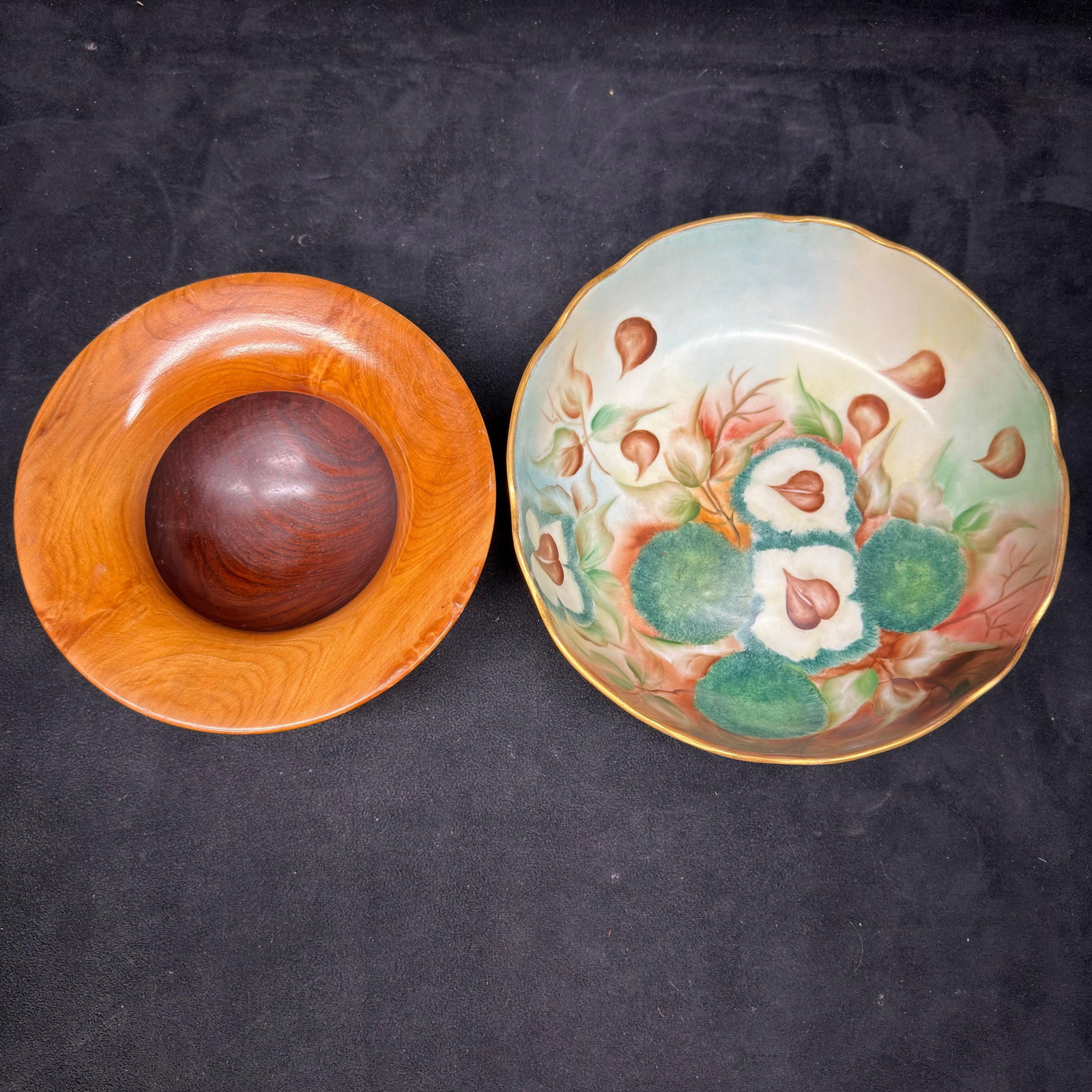 Decorative Wooden Bowl and Royal Austria Hand-Painted Footed Porcelain Dish: Two decorative bowls, including a turned hardwood bowl with a contrasting inset center, markings on the underside, and a hand-painted porcelain footed bowl by O.E.G. Royal Austria featuring floral dec