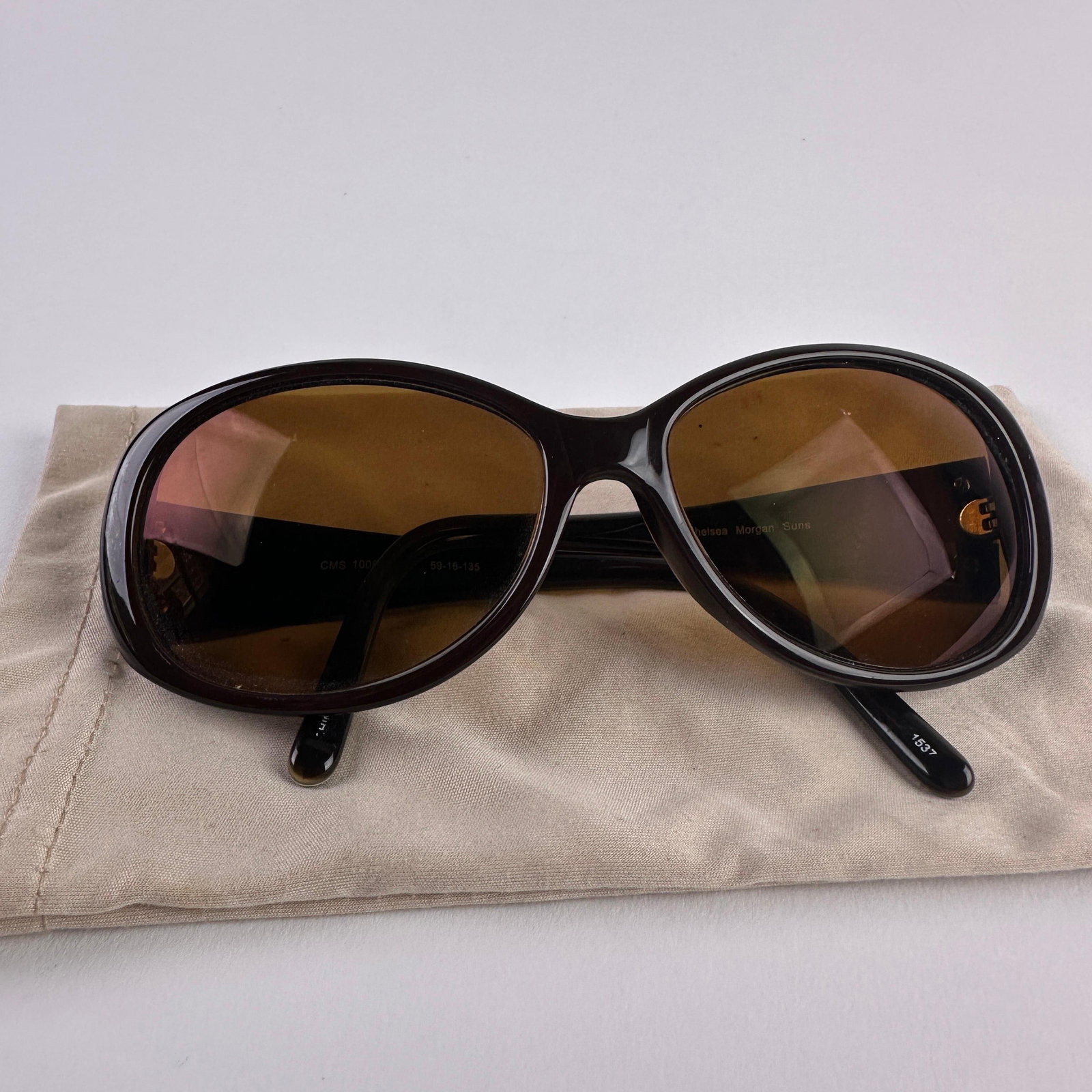 Chelsea Morgan Suns CMS 1006 Eye Sunglasses Brown 59-16-135 Corrective Lens: Chelsea Morgan Suns model CMS 1006 BR sunglasses with brown tinted corrective/prescription lenses and oversized oval frames. Features brown translucent frame fronts with decorative metal and faux tort