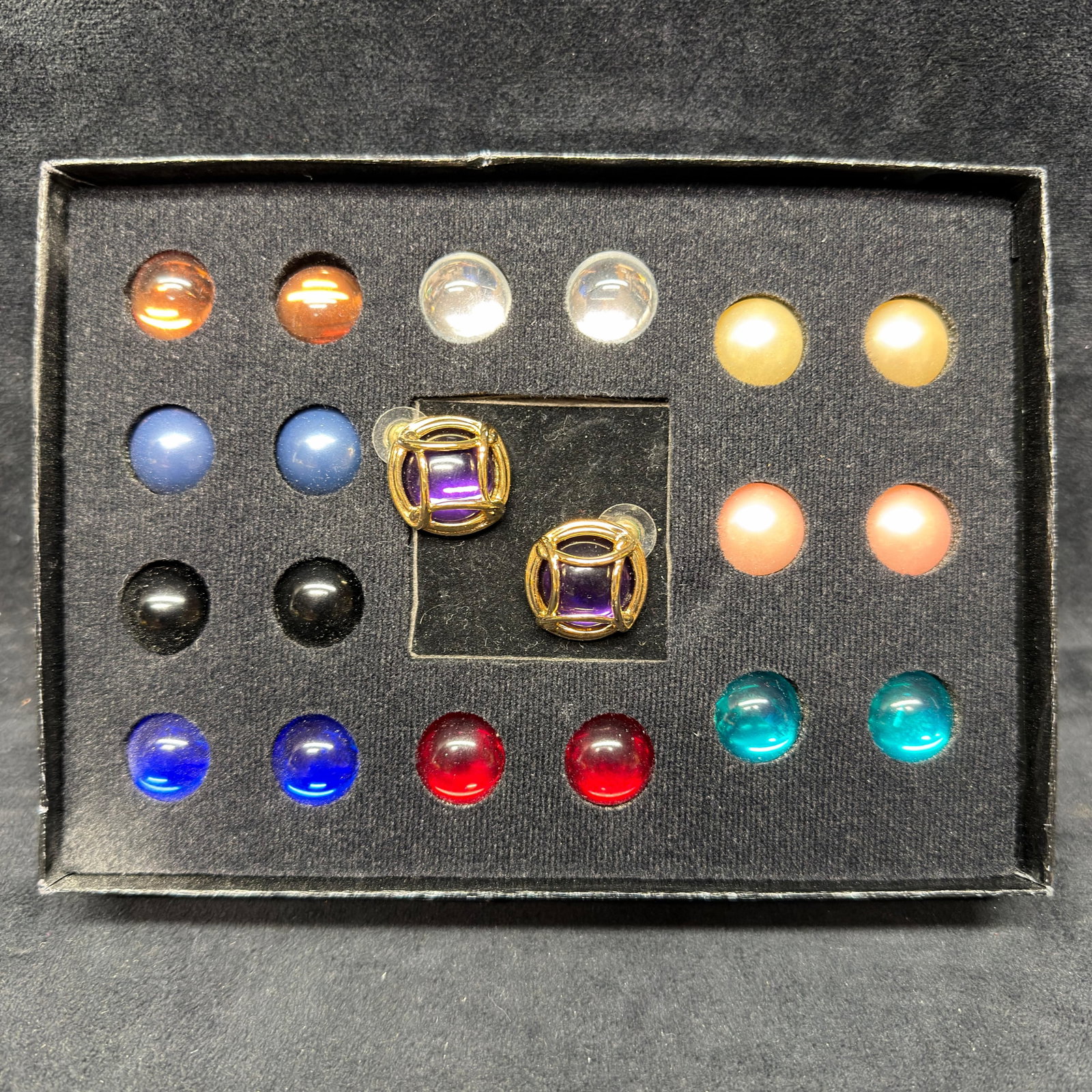 Joan Rivers Classics Collection Interchangeable Cabochon Clip Earrings Set: Joan Rivers Classics Collection gold-tone clip earrings featuring interchangeable cabochon inserts in multiple colors. Set includes the original gold-tone clip earrings with purple cabochons and addit
