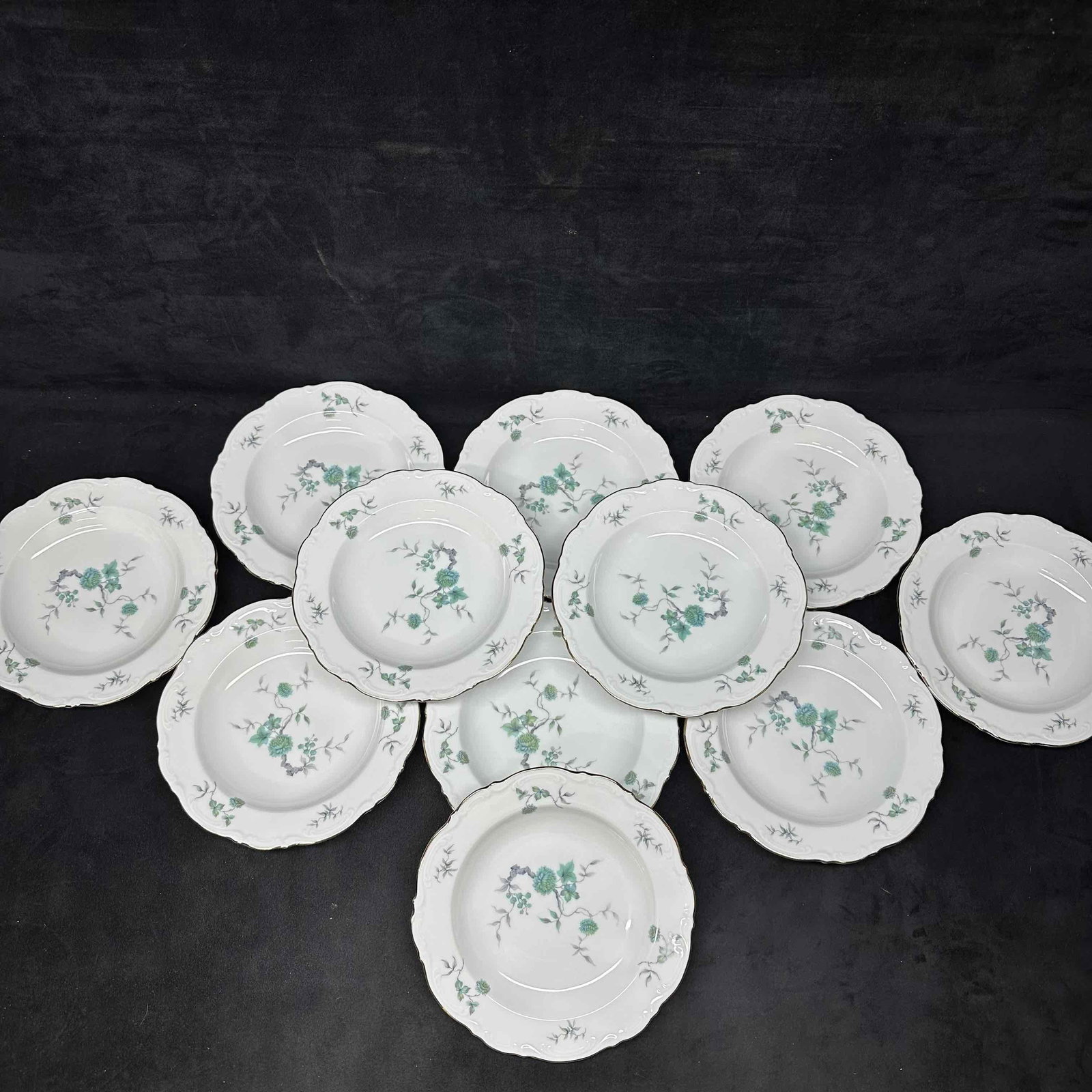 Green Ming Mitterteich Bavaria Germany Eleven Bowl Plate Set Gold Toned Trim: Light wear noticed along the bottom of each piece, no chips, cracks, or breaks in the porcelain. This set includes eleven (11) bowl plates. These items are in good pre-owned, previously disp