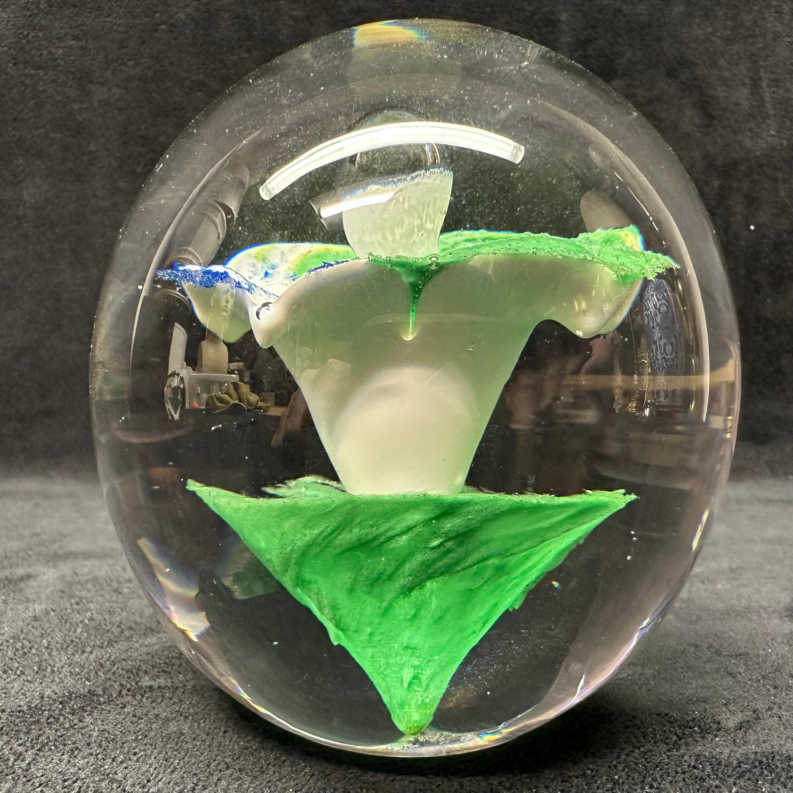 Studio Ahus Sweden Art Glass Paperweight Floral Abstract White Blue Green Flower: Studio Ahus art glass paperweight featuring a clear spherical form with an internal abstract composition in green, white, and blue glass. Designed and produced in Sweden. Retains original Studio Ahus