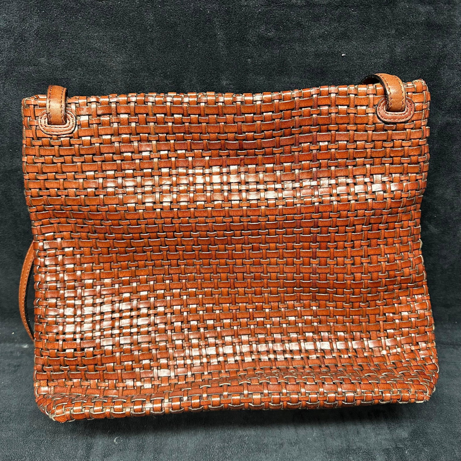 Cee Klein Brown Woven Leather Shoulder Handbag: Cee Klein woven leather shoulder bag featuring a tightly braided leather body in a warm brown tone. Rectangular form with leather shoulder strap and fabric-lined interior. Interior includes original