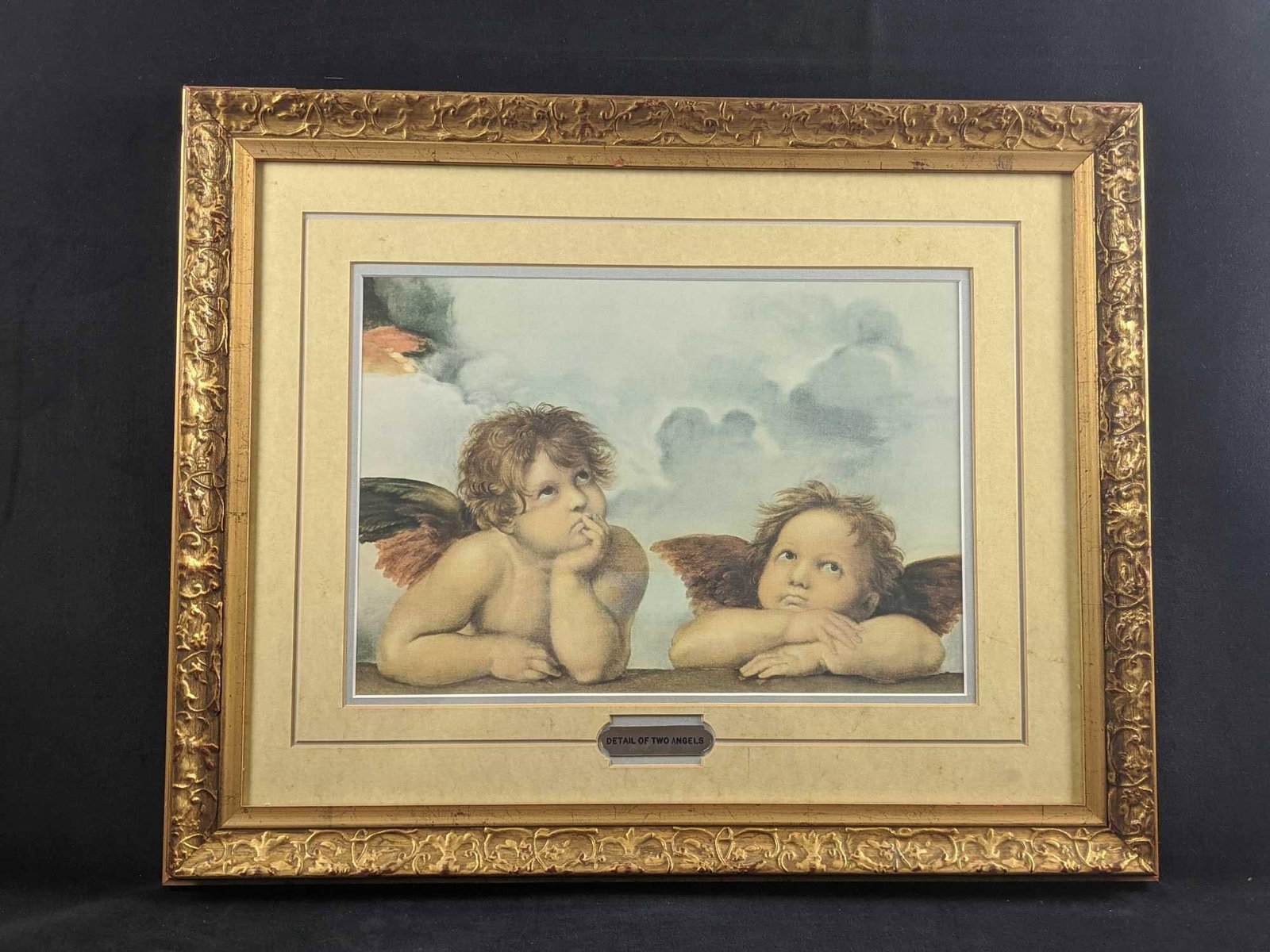 Framed Detail Of Two Angels From Sistine Madonna: This is a framed detail of the famous two winged angels from Raffaello Sanzio da Urbino's Sistine Madonna painting. The framed print is approx 24" x 20". Print is approx 15" 