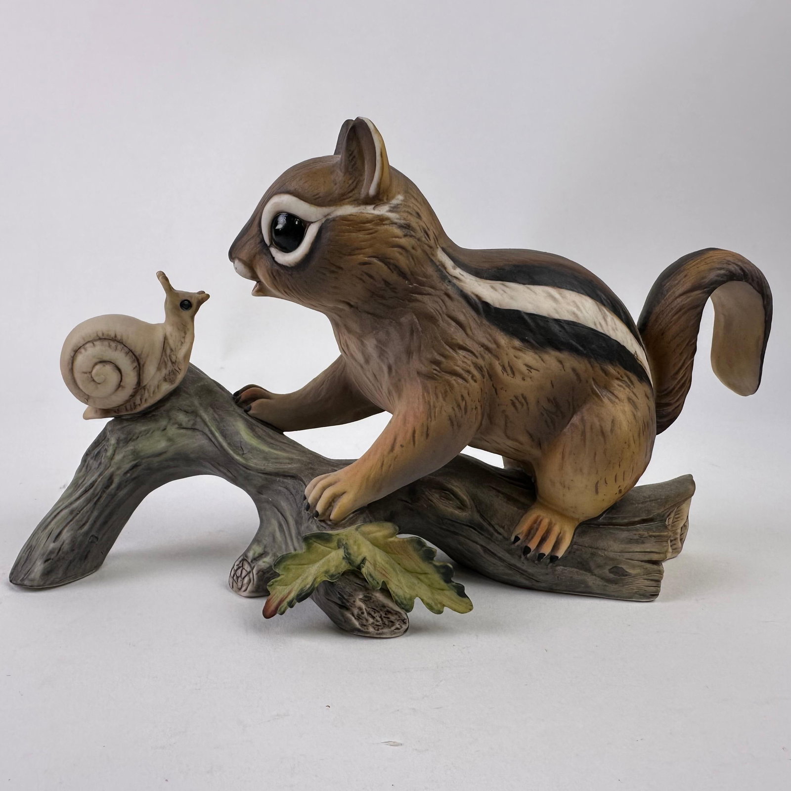 Masterpiece Hand Painted Porcelain Chipmunk with Snail Figurine by Homco: Masterpiece Hand-Painted Porcelain Chipmunk with Snail Figurine by Homco. Hallmark on the bottom of the figure. This item is in pre-owned, previously displayed condition with wear, minor markings, and