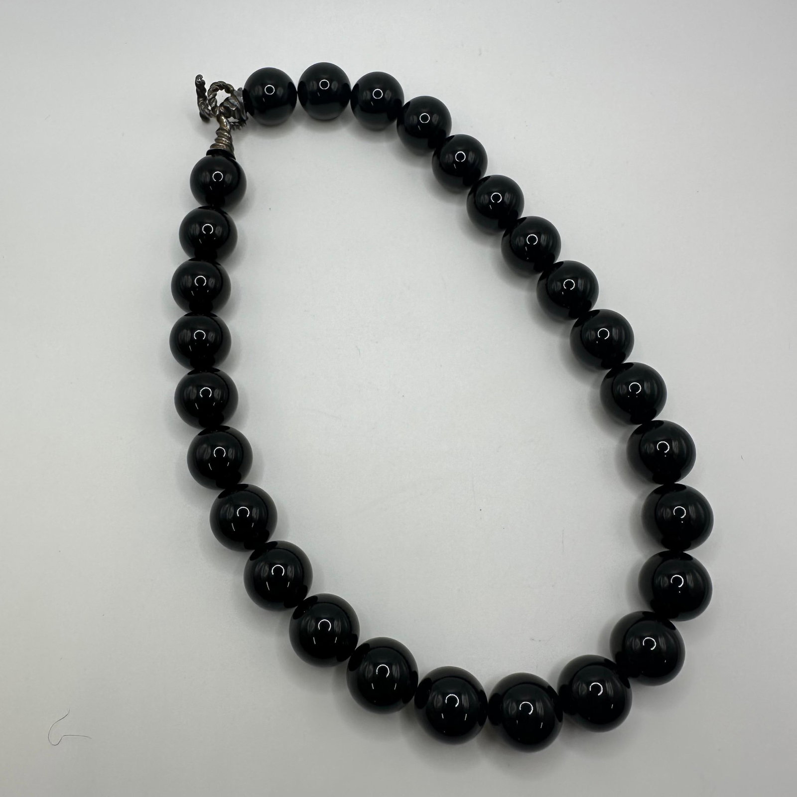 Black Onyx 15mm Beaded Vintage Tiffany and Co Sterling Silver Clasp Large Statement Necklace: This item is in good pre-owned, previously used/displayed condition with noticeable light wear and surface scratches. Please reference all photos for full details. This piece of jewelry has been teste