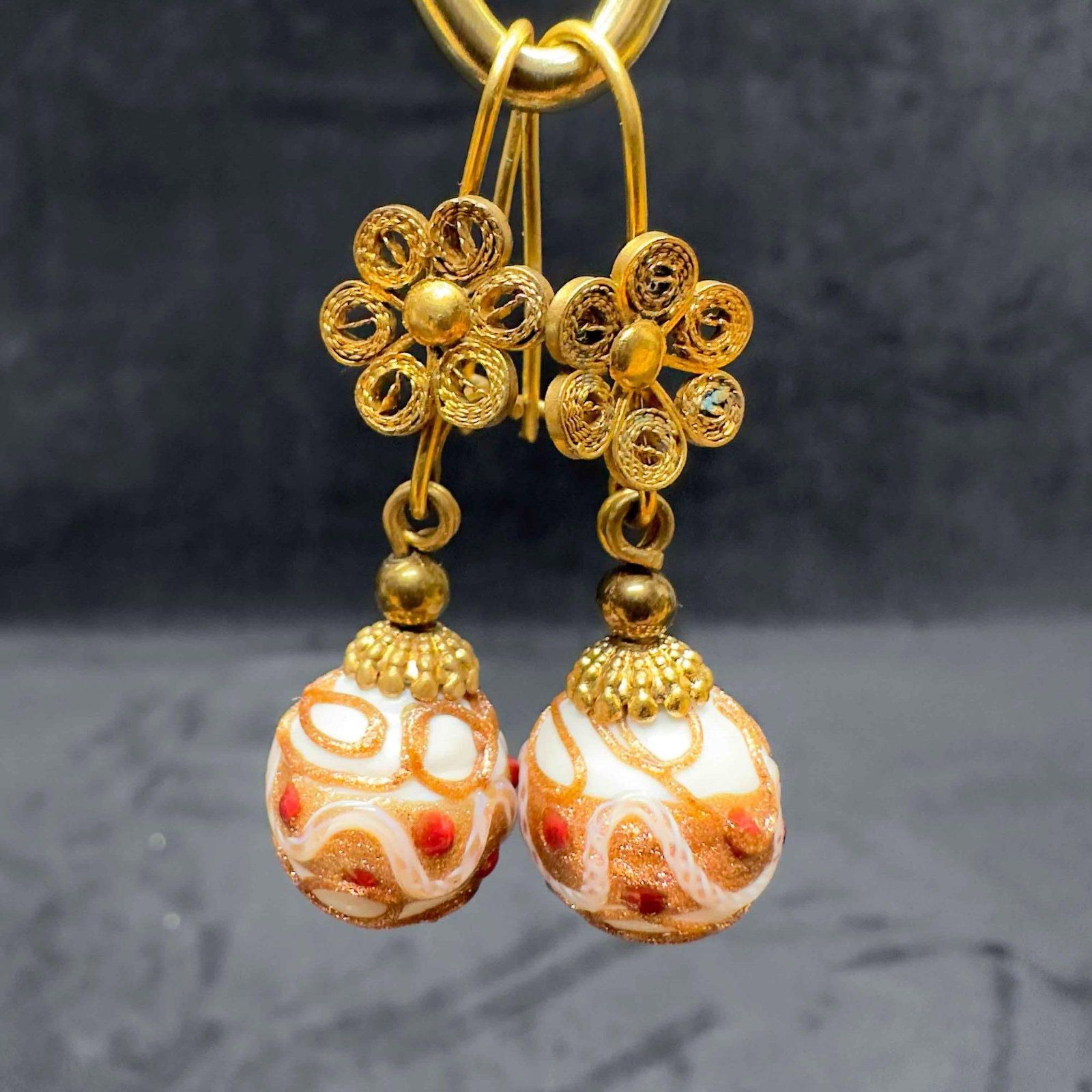 Murano Venetian Art Glass Lamp Work White Red Floral Accents Dangle Earrings E17: Murano Venetian Art Glass Lamp Work White Red Floral Accents Dangle Earrings E17. Earrings with white colored glass beads with beautiful hand painted designs on each. The earrings feature red col