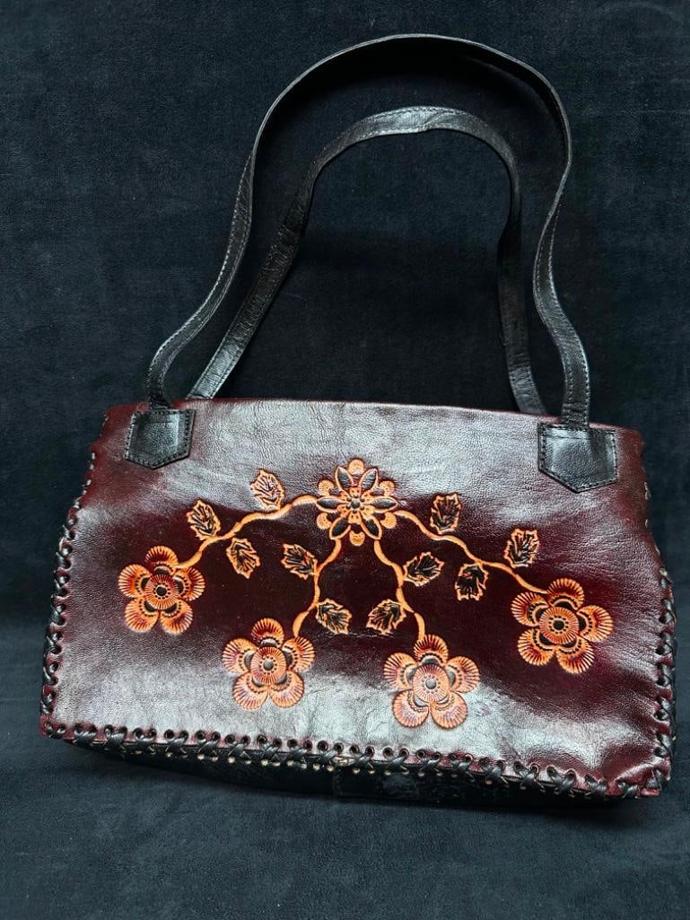 Vintage Leather Handicraft Purse Embossed Flowers B: Vintage Leather Handicraft Purse Embossed Flowers Leather handicraft purse, with embossed flower pattern on the sides of the bag. The bag is hand-stitched and has a very soft leather liner and inside 