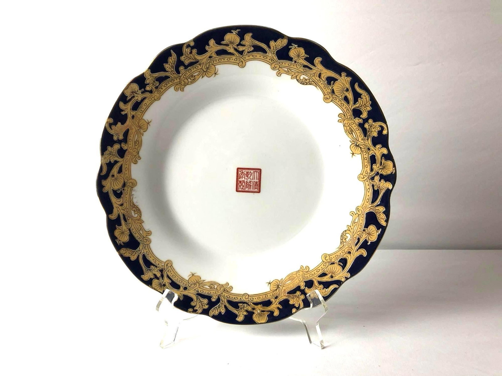 Rare Antique Chinese Blue & Gold Porcelain Plate Iron-Red Six-Character Qianlong Mark: Rare Chinese Porcelain Plate Iron-Red Six-Character Qianlong Mark. This rare hand painted blue and gold plate bearing the symbol of the Qianlong Dynesty on its top instead of the