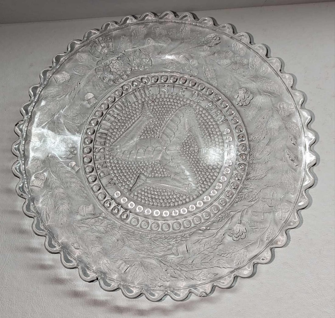 Vintage Isle Of Man Embossed Glass Souvenir Plate: Vintage Isle Of Man Plate Embossed Glass Souvenir Plate. This is approximately 9 3/4" x 9 3/4" x 1" and it weighs 1.52lb. The vintage glass plate has some light scratches.