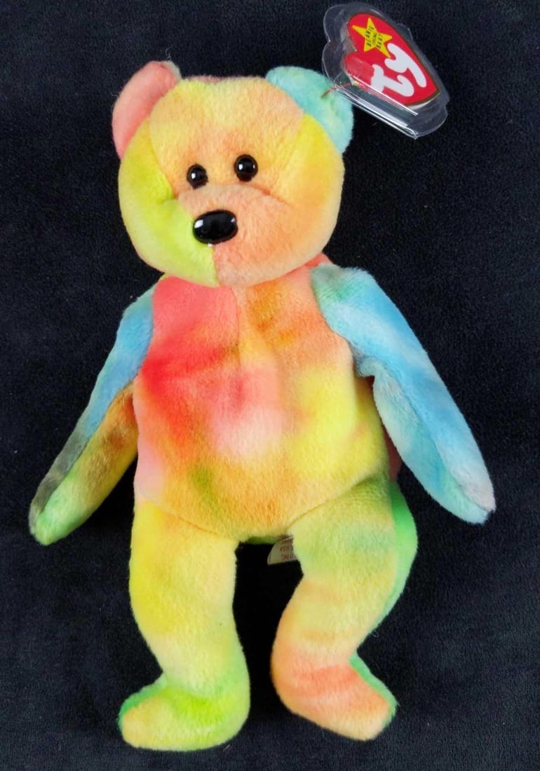 Retired Beanie Baby Garcia Tie Dye Bear Error Tag: Retired 'Garcia' Beanie Baby with errors on the tag. Such as date is displayed incorrectly. Should be "used" not "use", among others. Bear is approx 5" x 8". Is in good, unused condition with no known